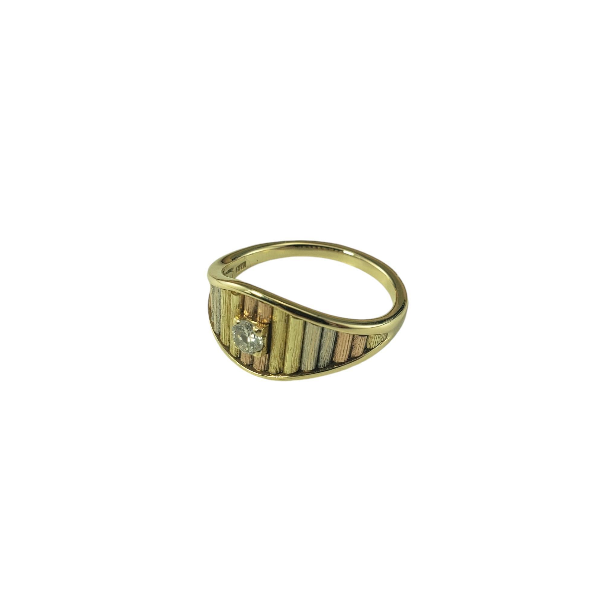 14K Tricolor Gold and Diamond Ring Size 6.25-

This lovely ring features on round brilliant cut diamond set on 14K yellow, white, and rose gold. Front of ring measures 9 mm. Shank: 2 mm.

Approximate total diamond weight: .14 ct.

Diamond color: