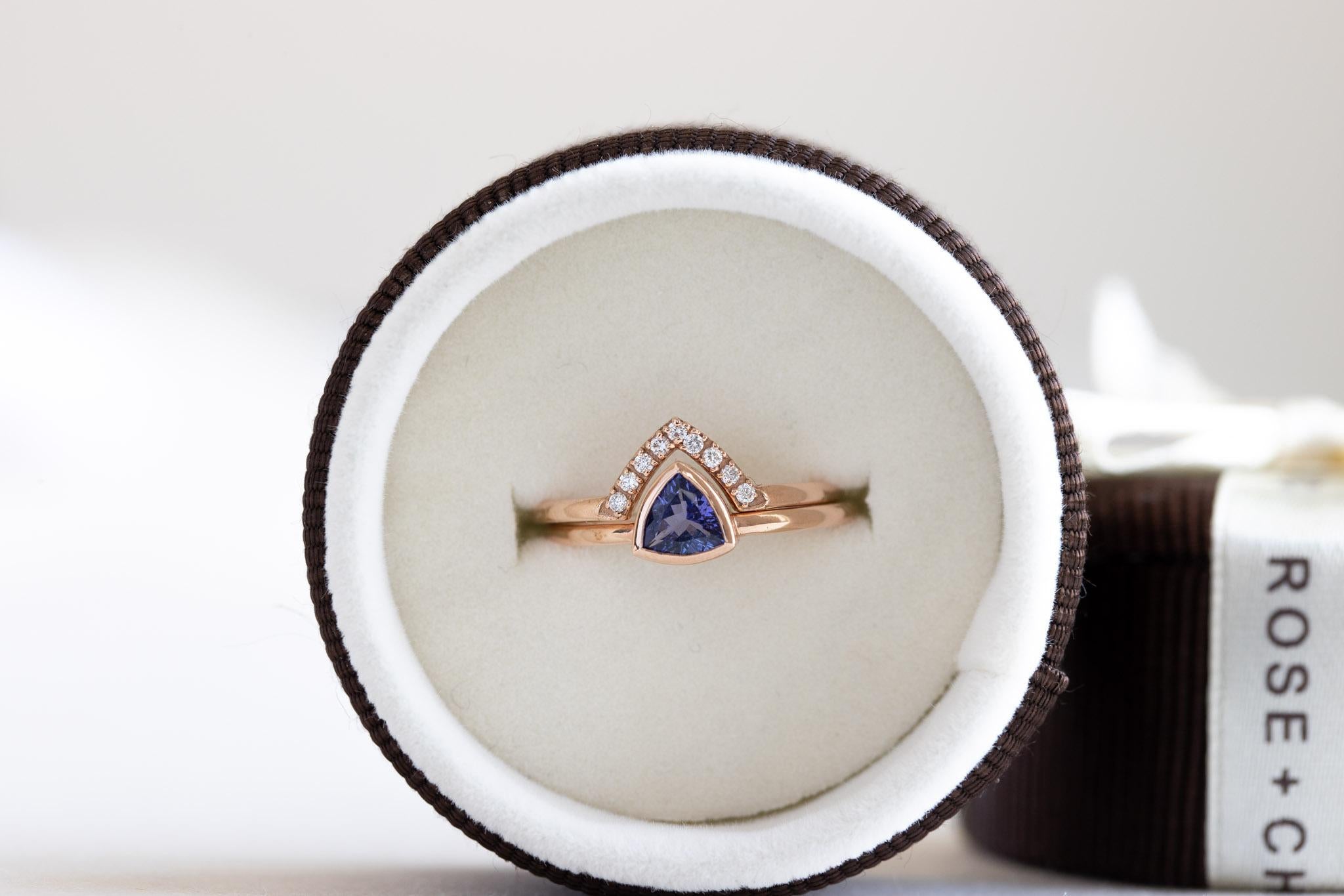 Trillion cut natural tanzanite ring stacked with diamonds chevron ring guard.
Set of two rings
Stone weight: 0.450 carat tanzanite
14k Solid rose gold fully hallmarked.
Stone Size: 5mm X 5mm tanzanite
Trillion cut
Clarity: SI-GHI Diamonds
Nine 1.2mm