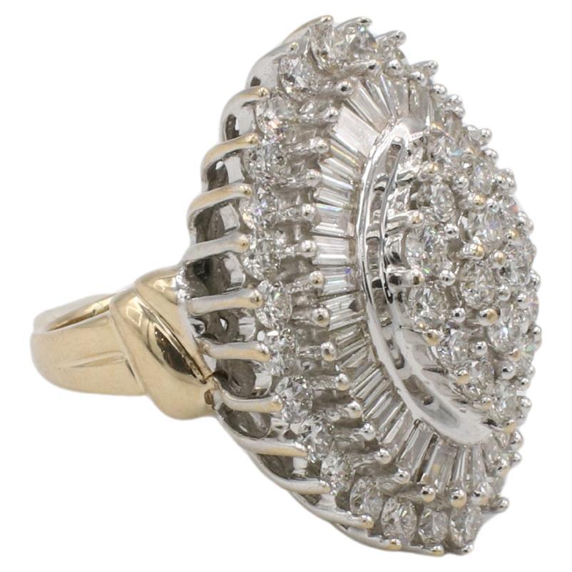 14 Karat Two Tone Natural 4.00 Carat Round 
Baguette Diamond Cluster Cocktail Ring 
Metal: 14k white/yellow gold
Weight: 13.17 grams
Diamonds: Approx. 4.00 CTW H-I VS round 
baguette natural diamonds
Size: 6.5 (US)
Top: 23 x 29mm
Height: