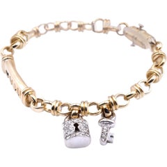 14 Karat Two-Tone Bracelet with Diamond Key and Lock Charms