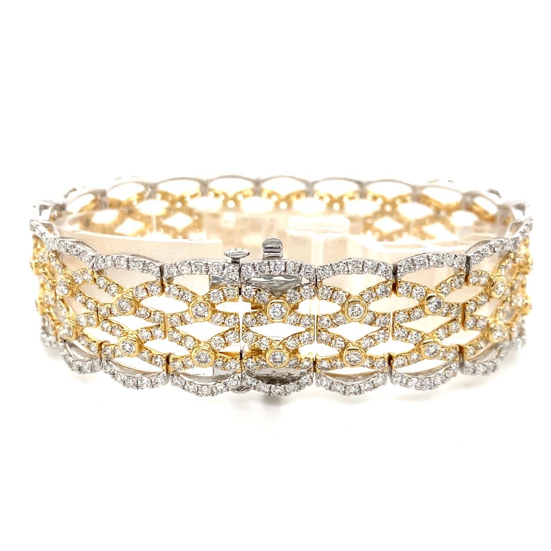 This stunning bracelet will compliment any occasion. With its intricate woven design and over 10 carats of diamonds this bracelet is sure to stand out. The white accents along the edges of the bracelet mixed with the yellow gold adds a timeless feel
