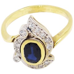 14 Karat Two-Tone Gold 1.7 Carat Oval Sapphire and Diamonds Ring