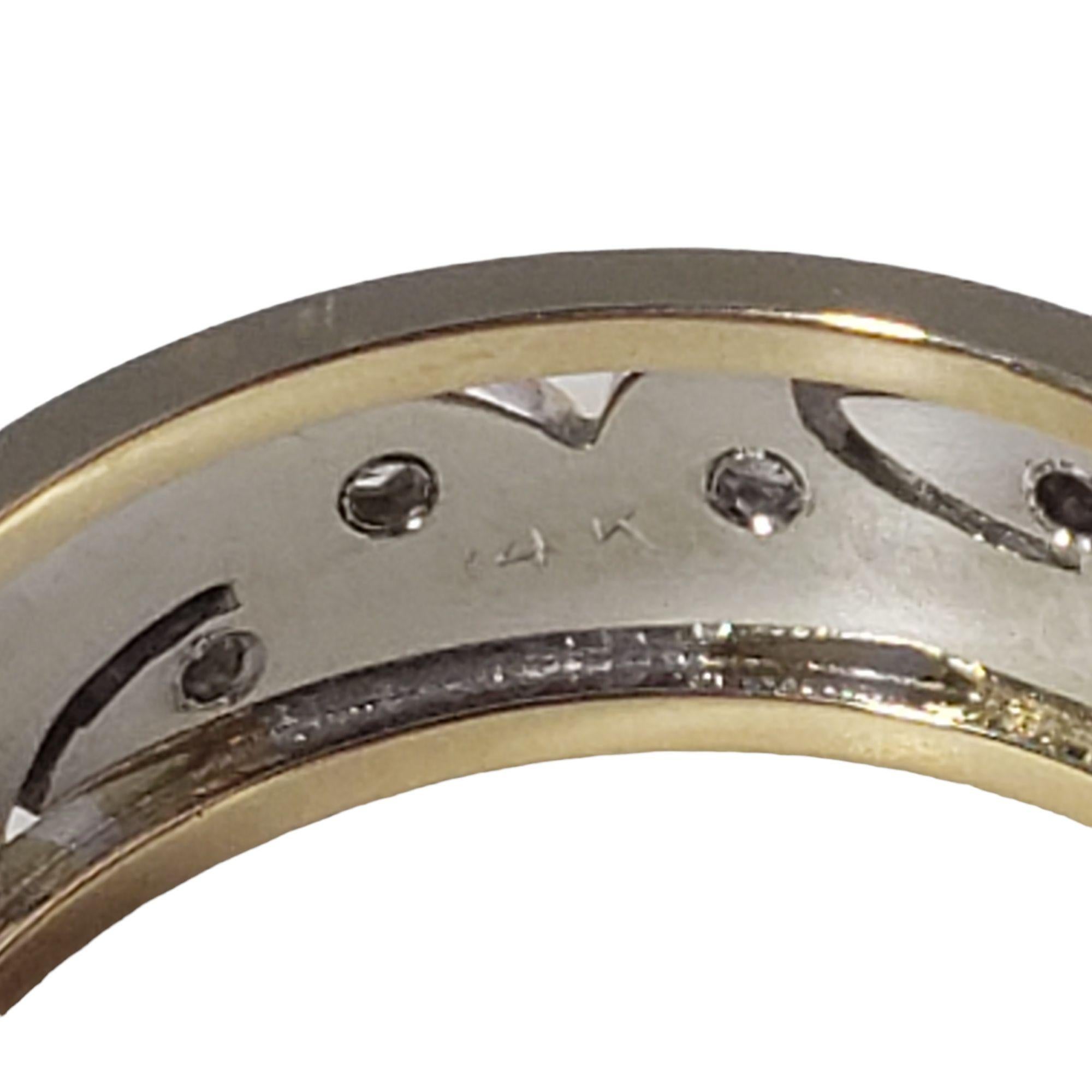 Vintage 14 Karat Two Tone Gold and Diamond Band Ring Size 9-

This lovely band features 18 round single cut diamonds set in beautifully detailed 14K yellow and white gold. Width: 7 mm.

Approximate total diamond weight: .15 ct.

Diamond color: