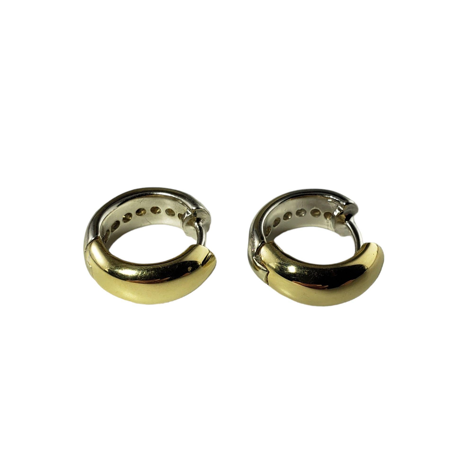 Vintage 14 Karat Two Tone Gold and Diamond Huggie Earrings-

These lovely 14K two tone gold hinged earrings each feature seven round brilliant cut diamonds. Width: 5 mm.

Approximate total diamond weight: .70 ct.

Diamond color: H-I

Diamond