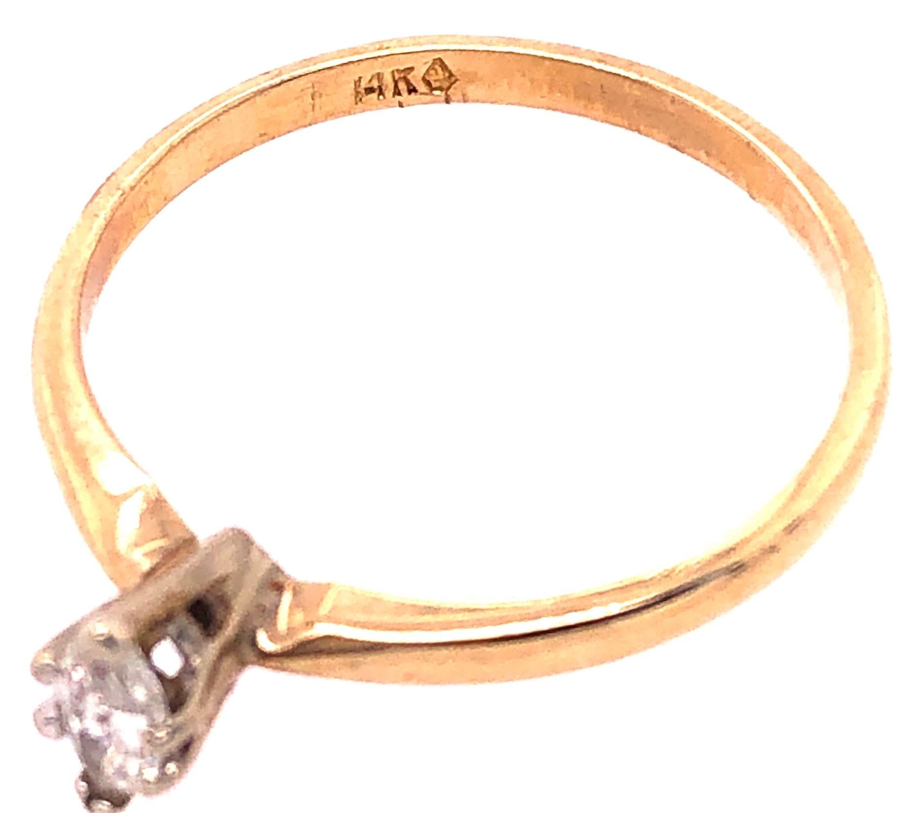 14 Karat Two Tone Gold Diamond Engagement Ring 0.15 Total Diamond Weight.
Size 8
2 grams total weight.