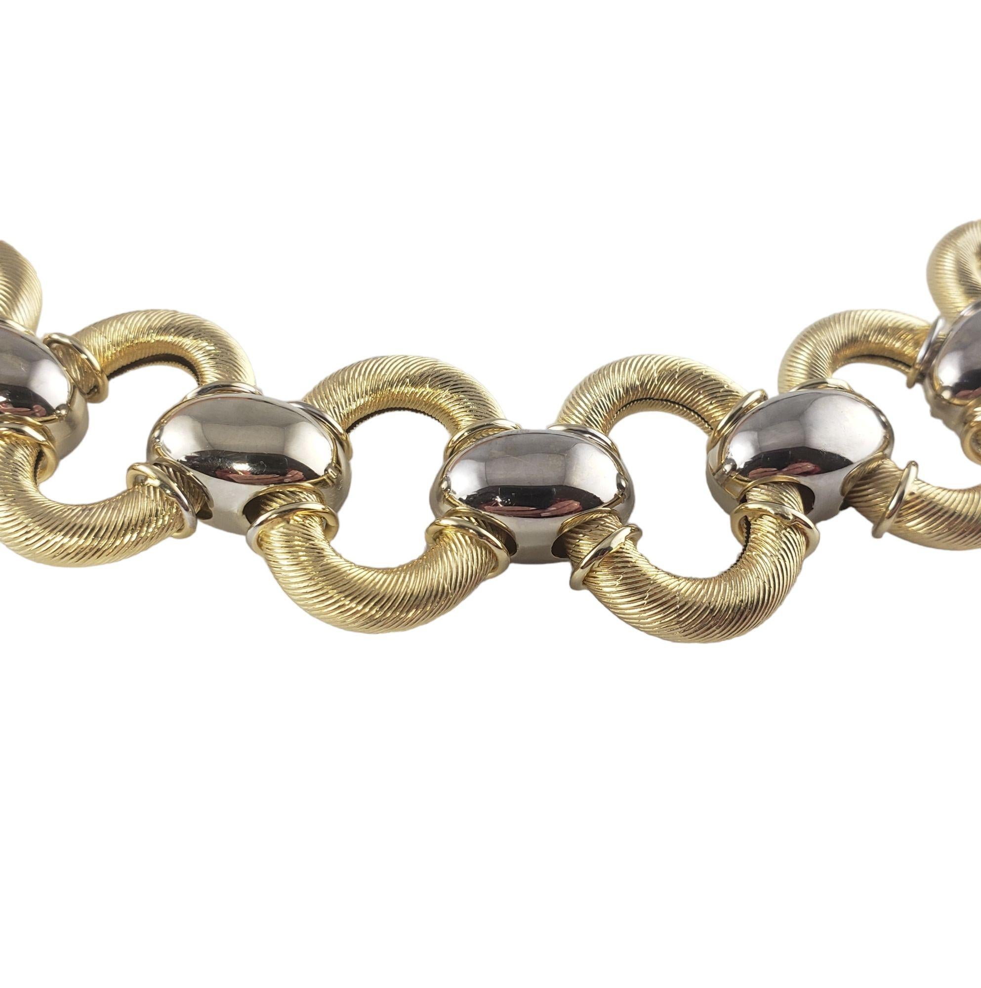 Vintage 14 Karat Two Tone Gold Link Bracelet-

This stunning link bracelet is crafted in beautifully detailed 14K yellow and white gold. Width: 25 mm.

Size: 6.75 inches

Weight: 23.5 dwt. / 36.6 gr.

Stamped: 14K 1758AR Italy

Very good condition,