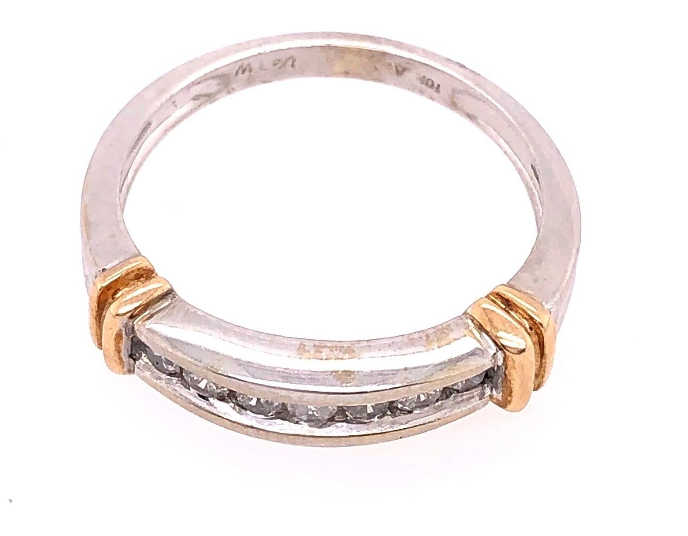 14 Karat Two Tone Gold Band Ring with Diamonds 0.25 Total Diamond Weight.
Size 7
3.3 grams total weight.