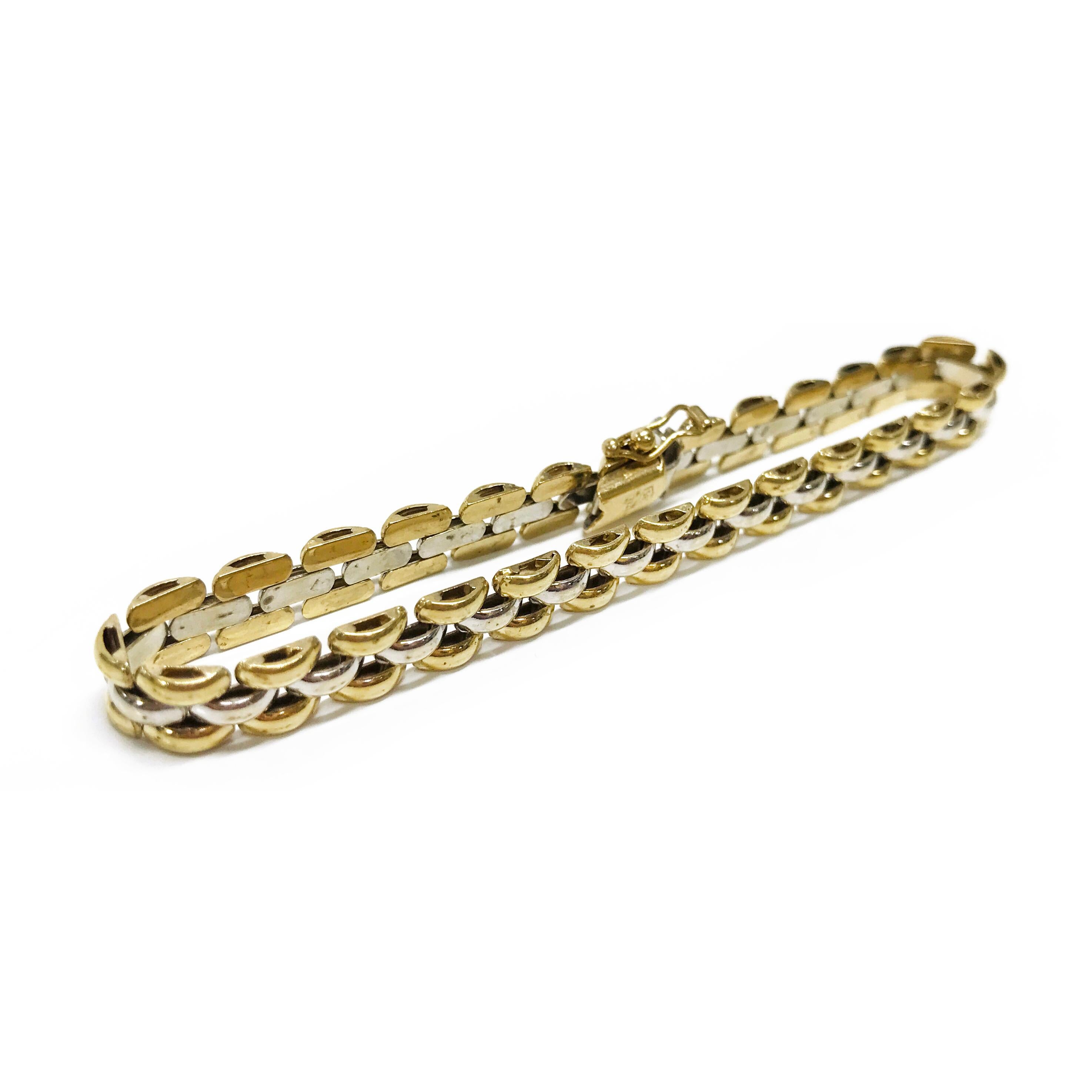 14 Karat two-tone panther-style link bracelet. This bracelet features 6mm white and yellow gold links. The bracelet is 7 3/4