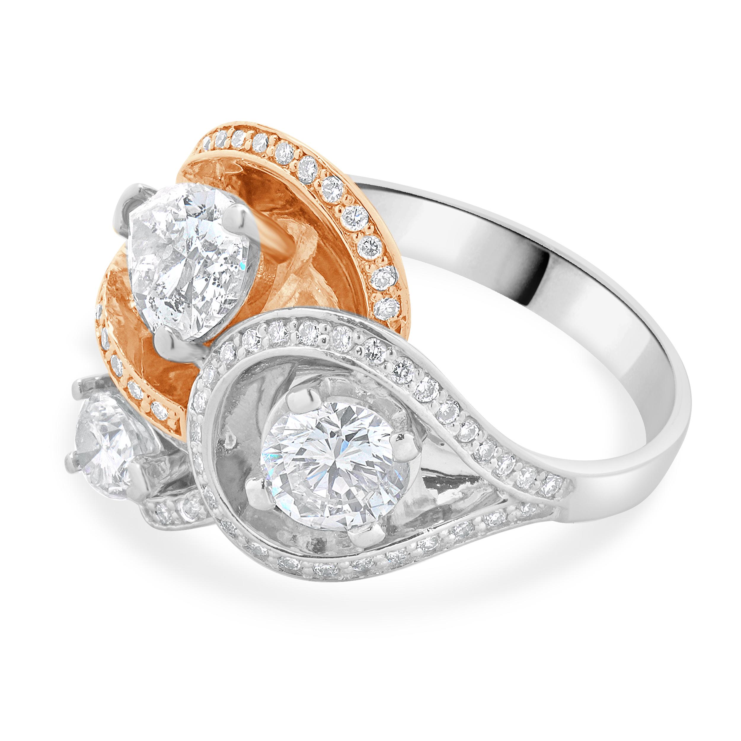 Designer: custom
Material: 14K rose & white gold  
Diamond:  2 pear cut = 1.30cttw 
Color: G / H
Clarity: SI2-I1
Diamond:  84 round brilliant cut = 0.90cttw
Color: H 
Clarity: SI2-I1
Size: 7.5 sizing available 
Weight: 8.33 grams
