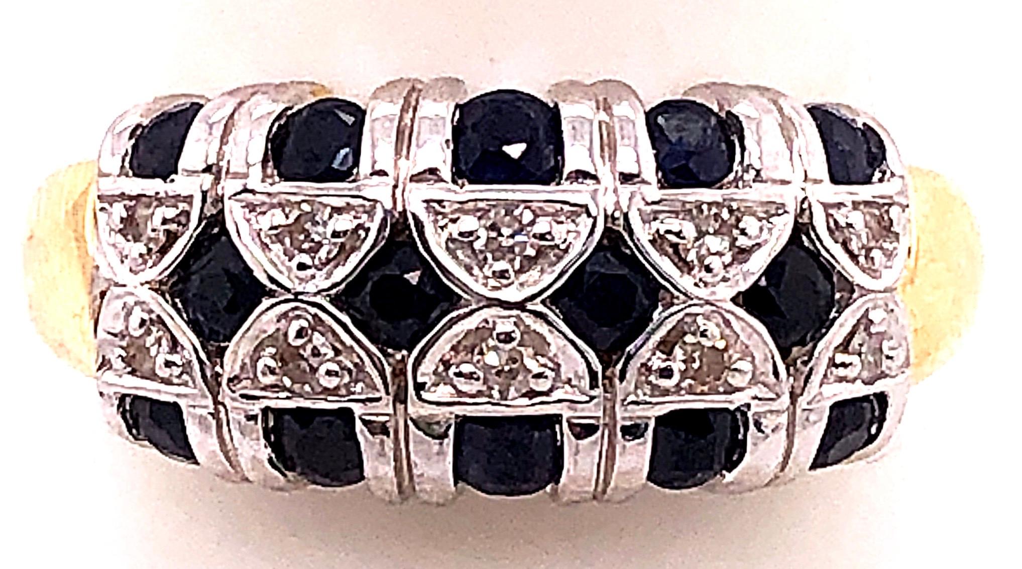 14 Karat Two Tone Yellow and Gold Sapphire And Diamond Band
0.35 total diamond weight.
1.00 total sapphire weight.
Size 9
5.42 grams total weight.
height: 10 mm
width: 15 mm

*This ring can be resized at your local jeweler.