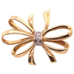 14 Karat Two-Tone Yellow and White Gold Bow Brooch with Diamond Accents