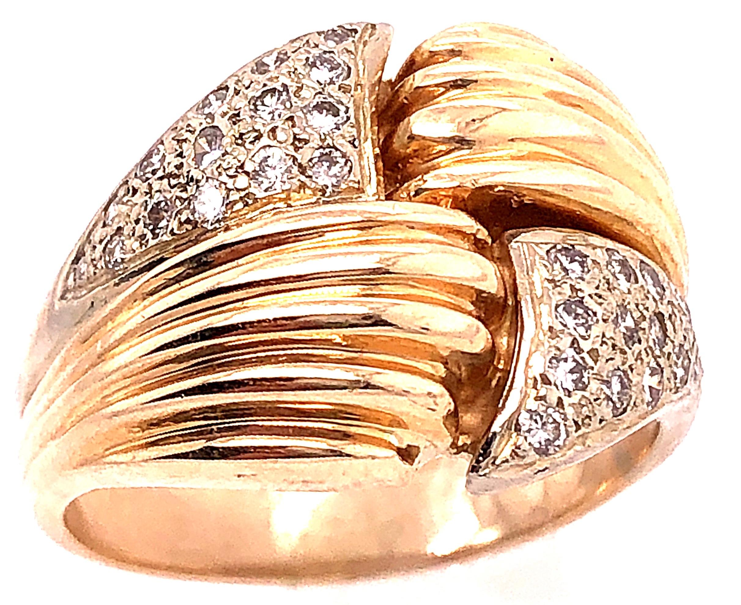 14 Karat Two Tone Yellow and White Gold Fashion Ring with Cubic Zircon.
30 piece round zircons.
9.45 grams total weight.
Size 8.25

