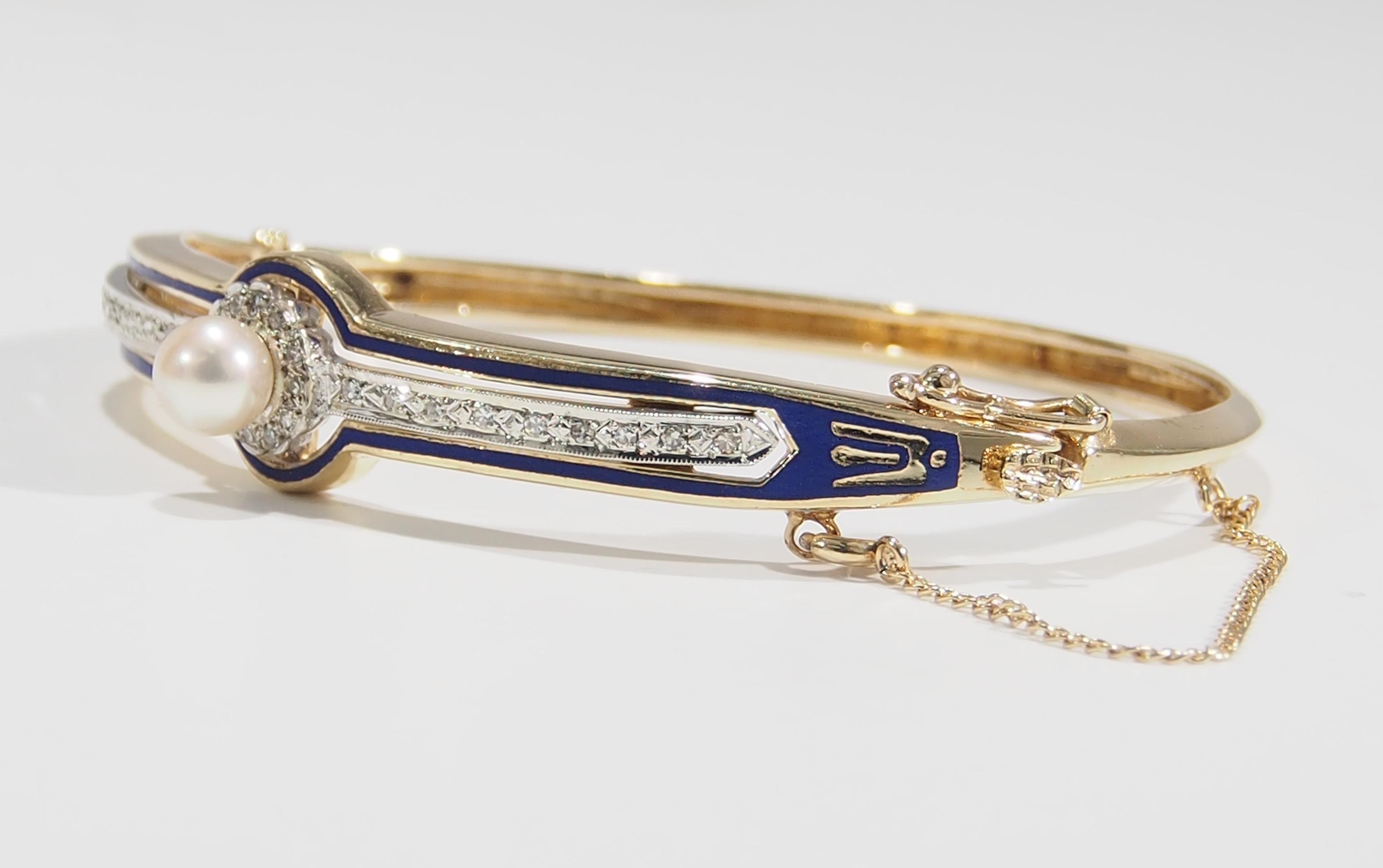 This is an intriguing 14K Yellow Gold Bangle Bracelet fashioned in the Victorian Period with Diamonds and Pearl. The classic design has cobalt blue Enamel with a delicate line of (30) Single Cut Diamonds, approximately 0.30ctw, I-K in Color, VS-SI