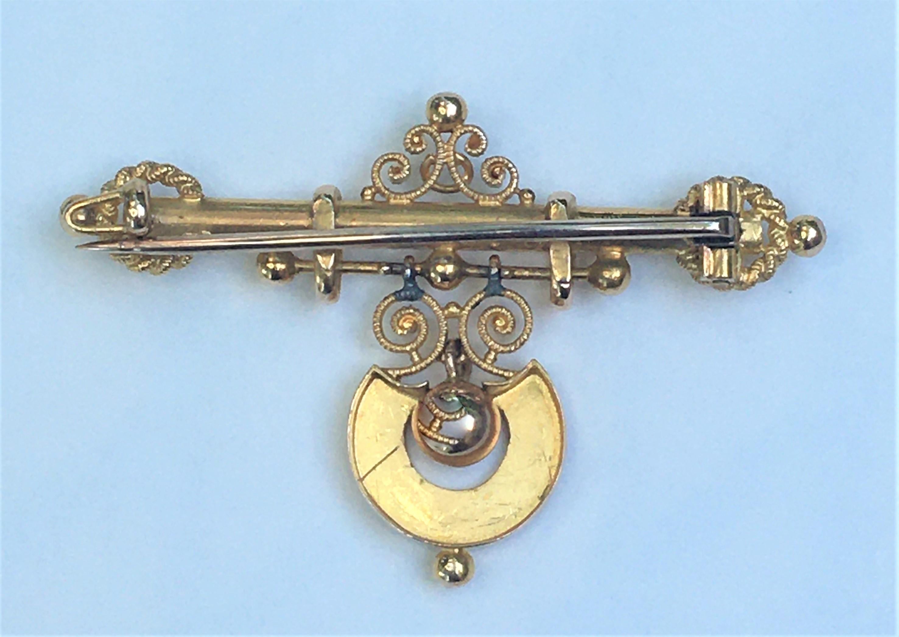 Beautiful Victorian inspired dangle brooch.
14 karat yellow gold with lots of detail 
Dangle part of brooch is approximately 13mm wide
Height approximately 29mm
Length approximately 45mm
Stick pin with c clasp
Has some patina