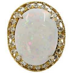 14 Karat Vintage Oval Opal and Diamond Halo Cocktail Ring