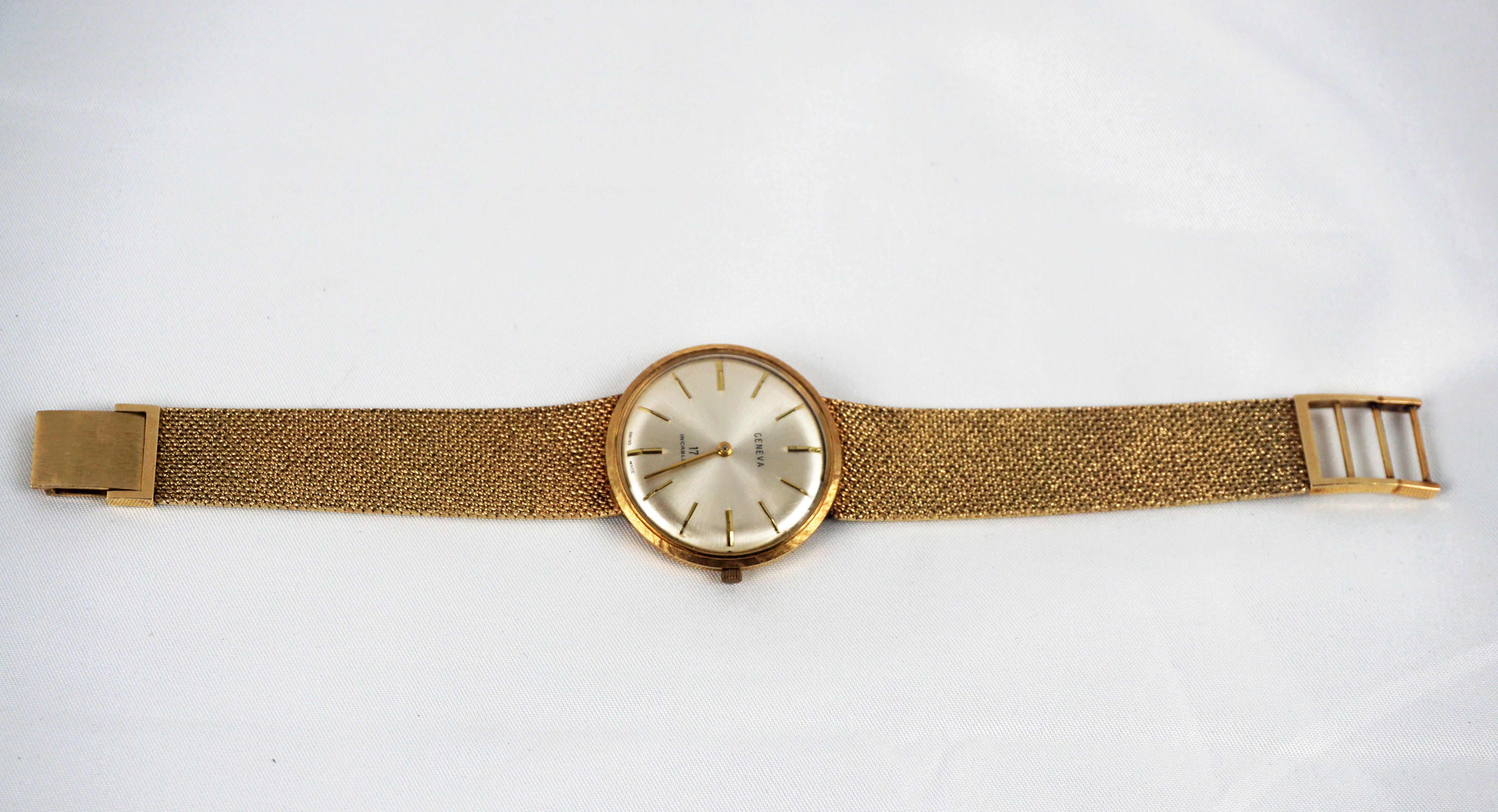 Mid Century Modern 14 Karat Vintage Yellow Gold Geneva Bracelet Watch

We are pleased to offer to timepiece connoisseurs this rare and fine 14 karat yellow gold vintage Geneva 17 incabloc watch. This Swiss watch details a 17 jewel ultra thin Geneva