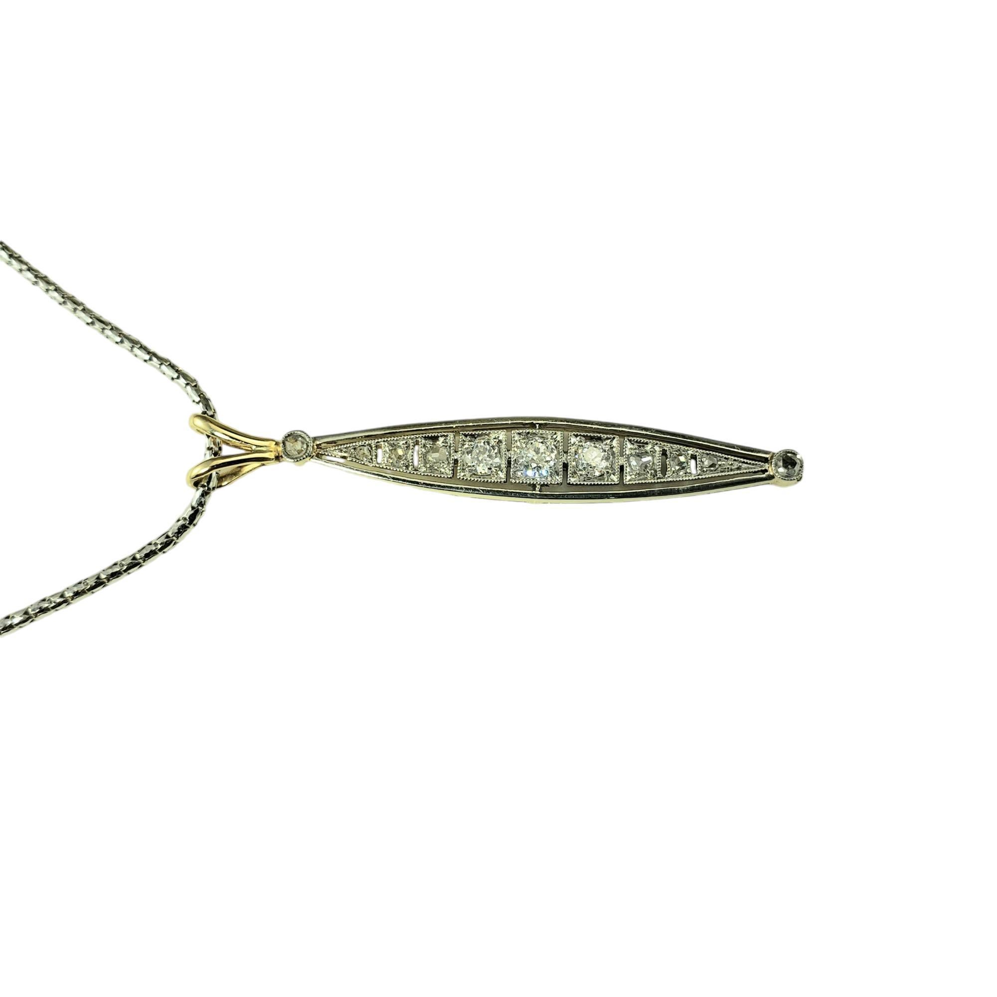 14 Karat Yellow and White Gold Diamond Pendant Necklace-

This sparkling estate piece has been repurposed into an elegant white and yellow gold pendant featuring 11 European and rose cut diamonds set in 14K white gold.  Suspends from a 22