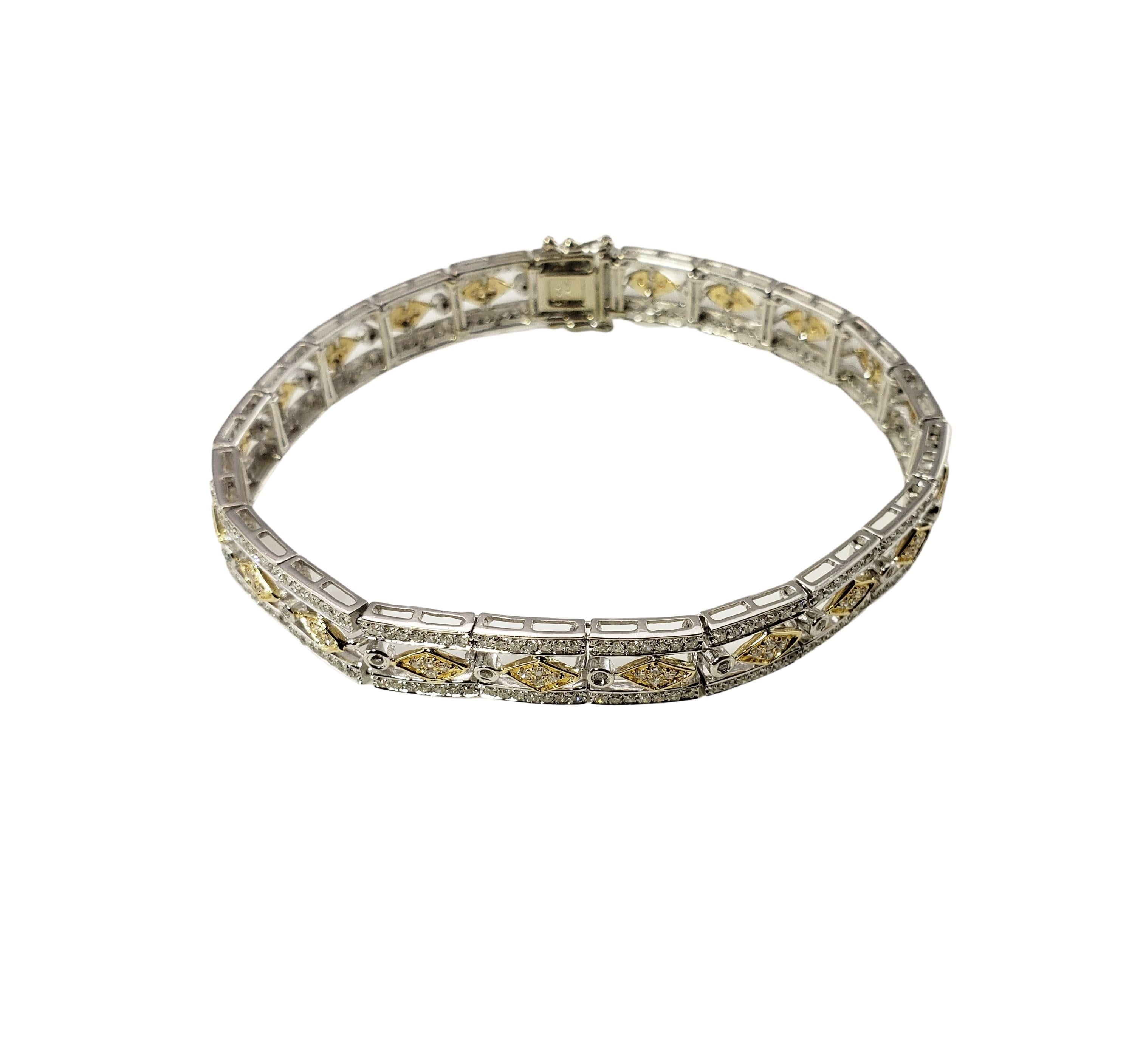 14 Karat White and Yellow Gold Diamond Bracelet-

This sparkling bracelet features 397 round single cut diamonds set in beautifully detailed 14K white and yellow gold.  Width:  8 mm.

Approximate total diamond weight:  2 cts.

Diamond color: