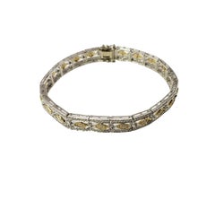 Bracciale con diamanti in oro bianco e giallo 14 carati