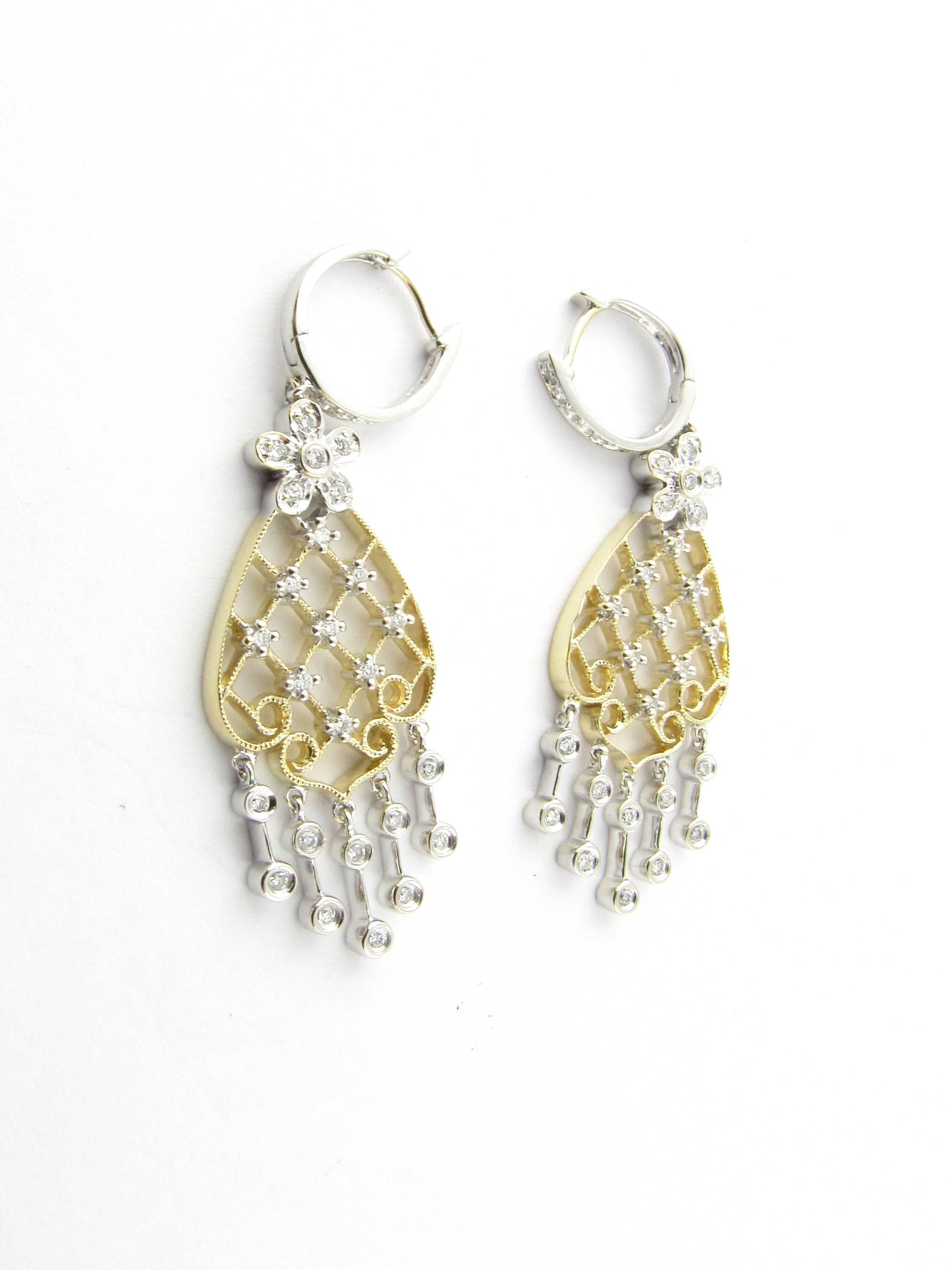 Vintage 14 Karat White and Yellow Gold Diamond Chandelier Earrings- 
These dazzling chandelier earrings each feature 34 round brilliant cut diamonds set in stunning white and yellow gold. 
Approximate total diamond weight: 1.40 ct. 
Diamond color: