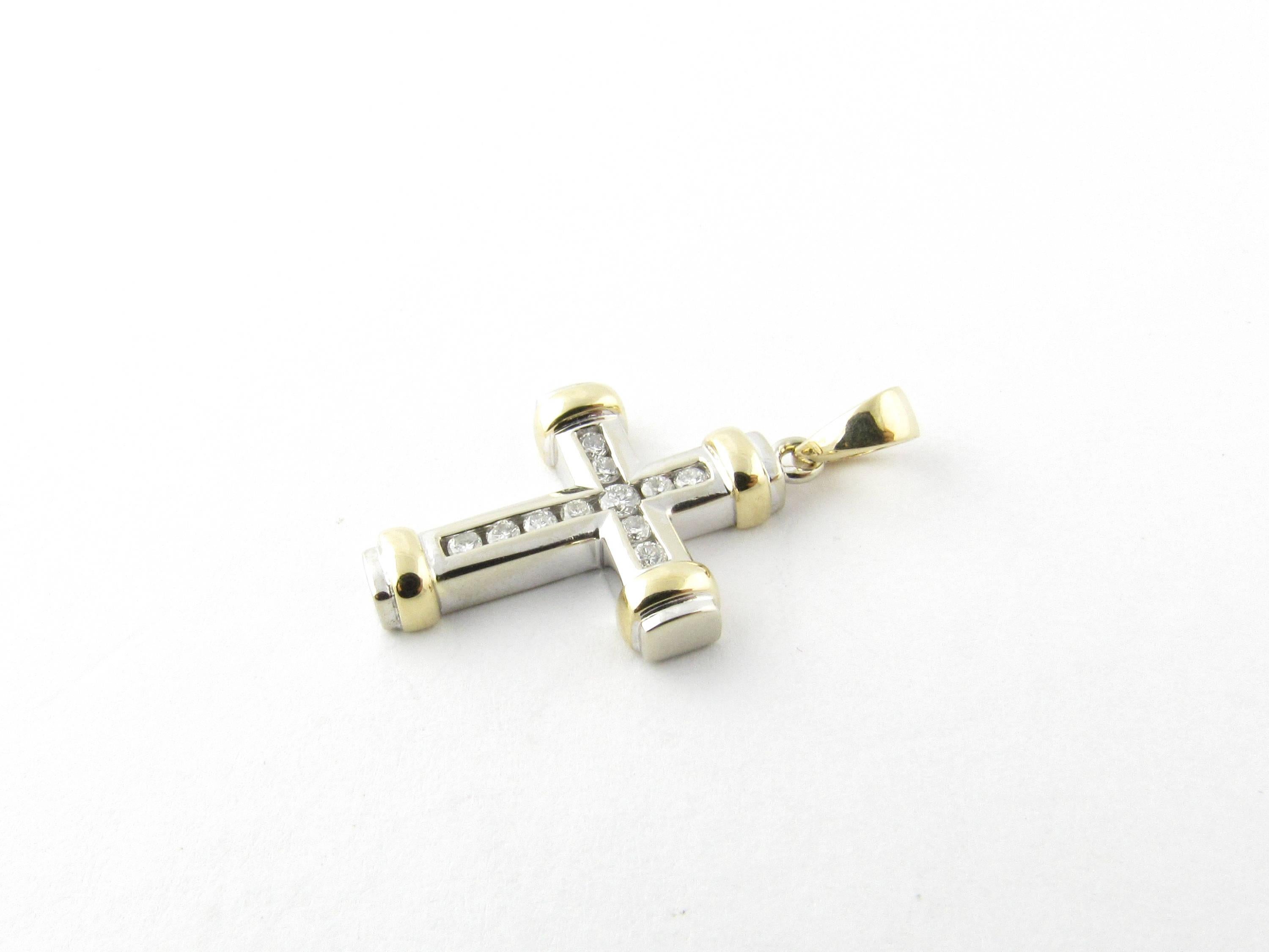 Vintage 14 Karat White and Yellow Gold Diamond Cross Pendant- 
This sparkling cross pendant features 11 round brilliant cut diamonds set in 14K white gold and accented with 14K yellow gold caps. 
Approximate total diamond weight: .24 ct. 
Diamond