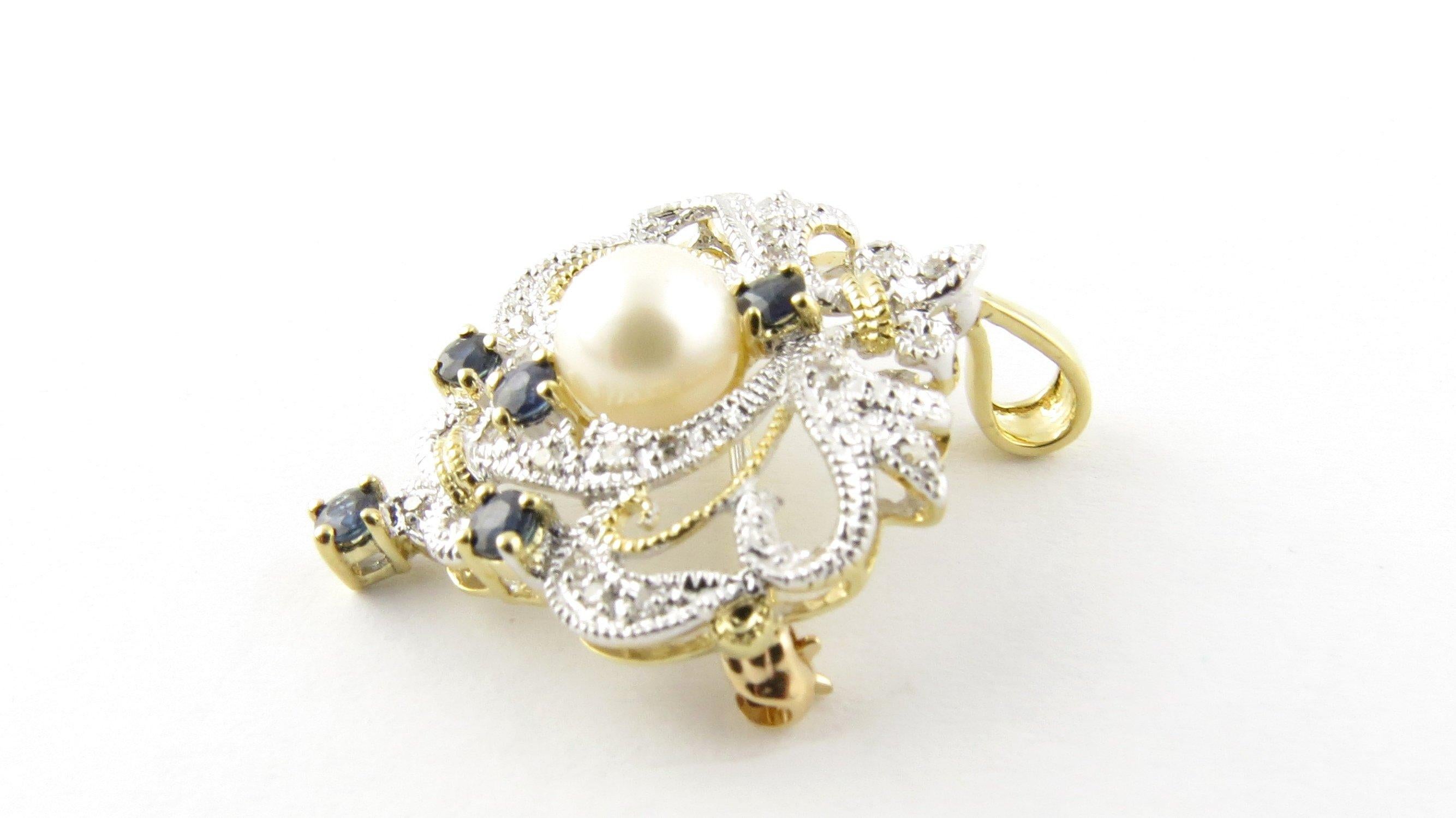 Vintage 14 Karat White and Yellow Gold Diamond, Sapphire and Pearl Brooch/Pendant- 
This stunning piece features 22 round brilliant cut diamonds, one cultured pearl (7 mm) and five round genuine sapphire set in exquisitely detailed 14K white and