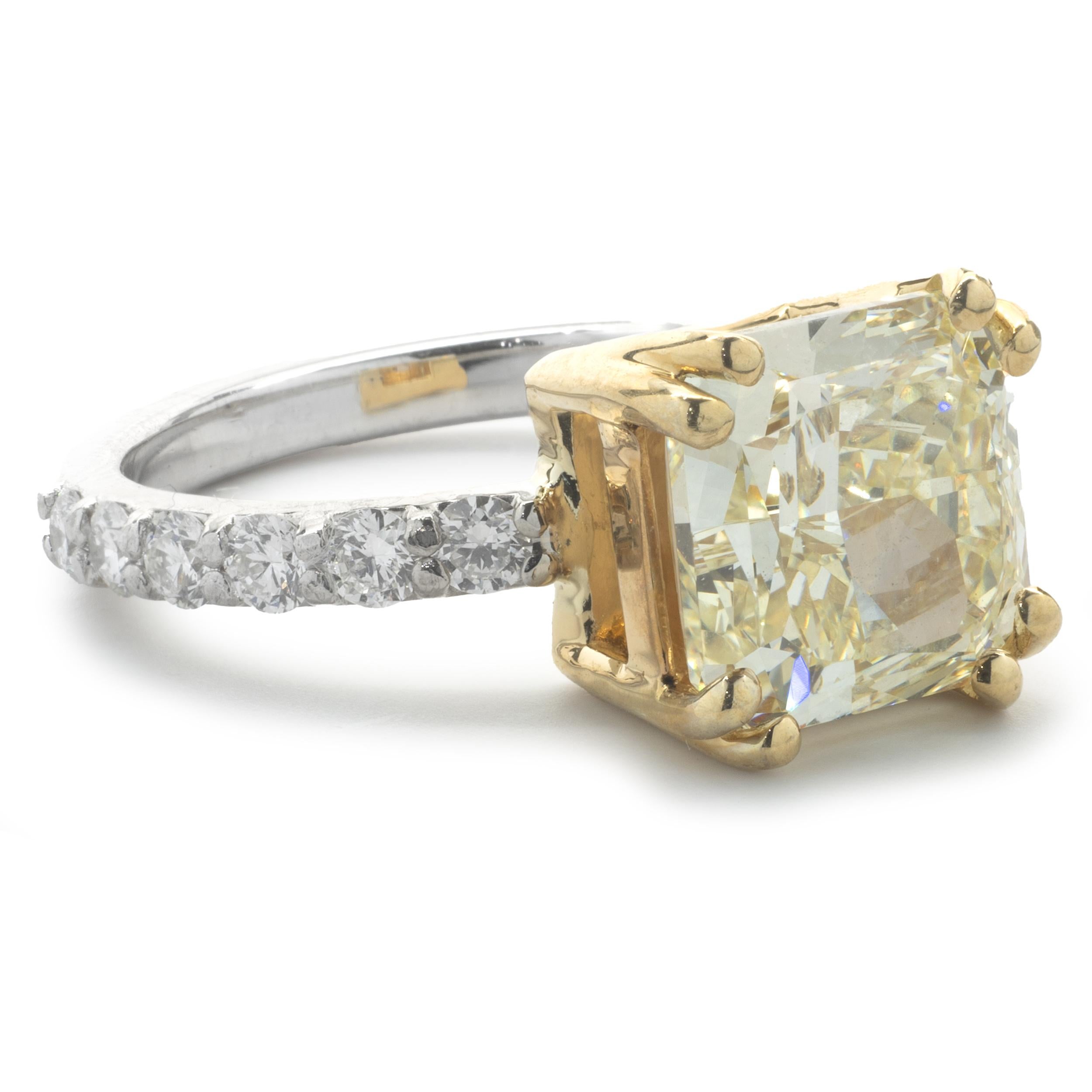 Designer: custom
Material: 14K yellow and white gold
Diamond: 1 cushion cut = 4.05ct
Color: Fancy Yellow
Clarity: VS1
GIA: 2155447660
Diamond: 12 round brilliant cut = .60cttw
Color: G
Clarity: VS1
Ring Size: 7 (please allow up to 2 additional