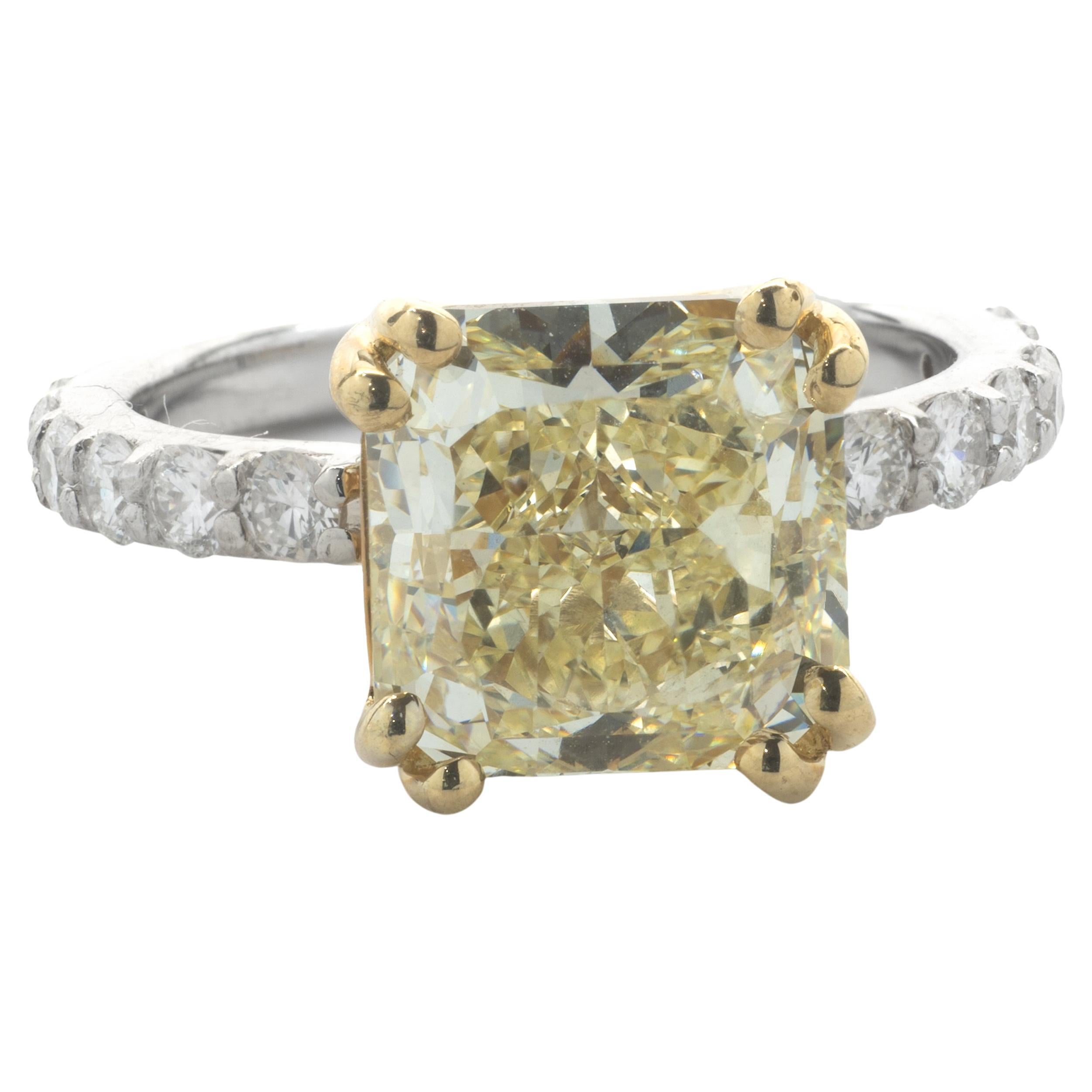 14 Karat White and Yellow Gold Fancy Yellow Cushion Cut Diamond Engagement Ring For Sale