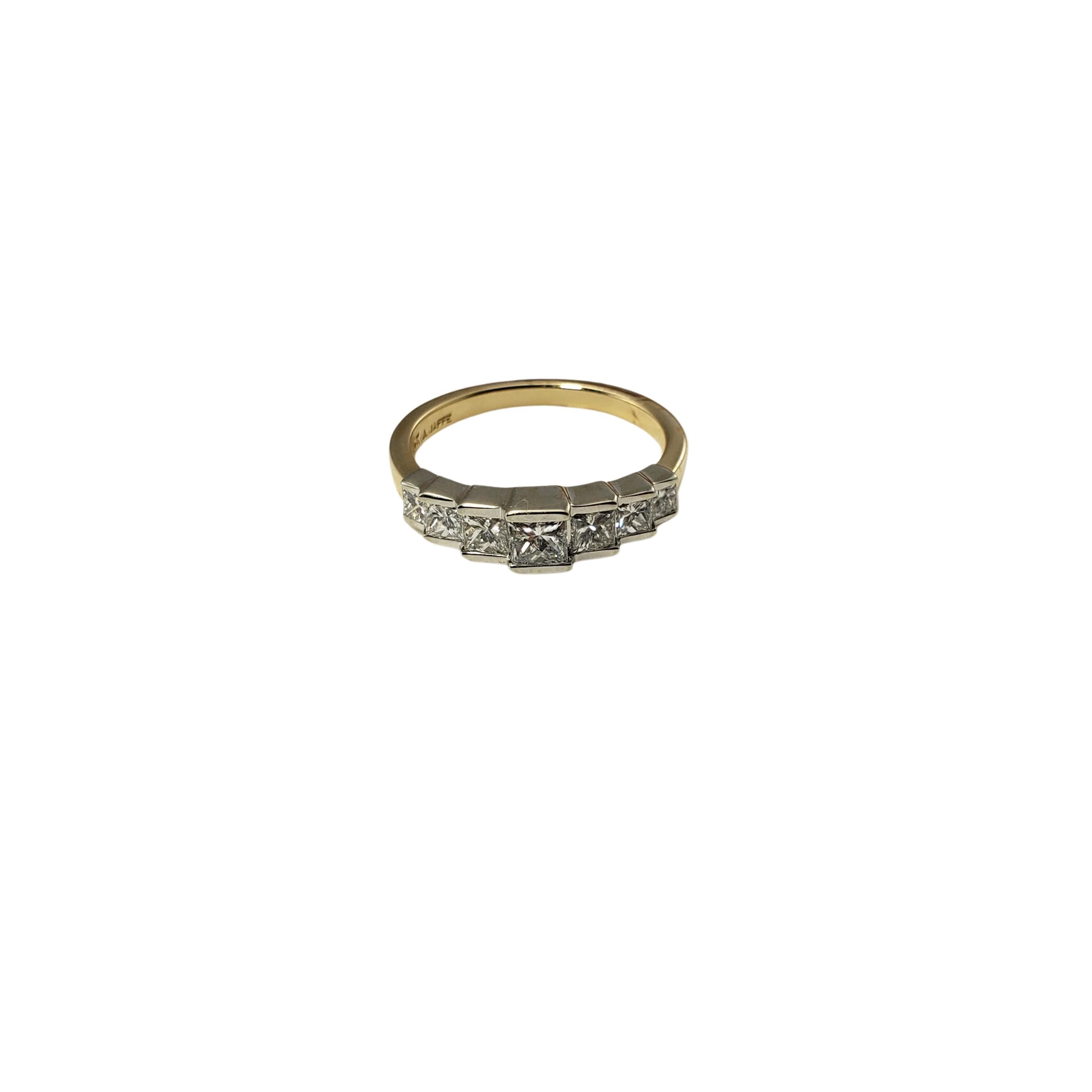 This sparkling ring features seven princess cut diamonds set in classic 14K white gold on a yellow gold band.  

Width:  5 mm.  Shank:  2 mm.

Approximate total diamond weight: .80 ct.

Diamond color: G

Diamond clarity: VS1-VS2

Ring Size: 