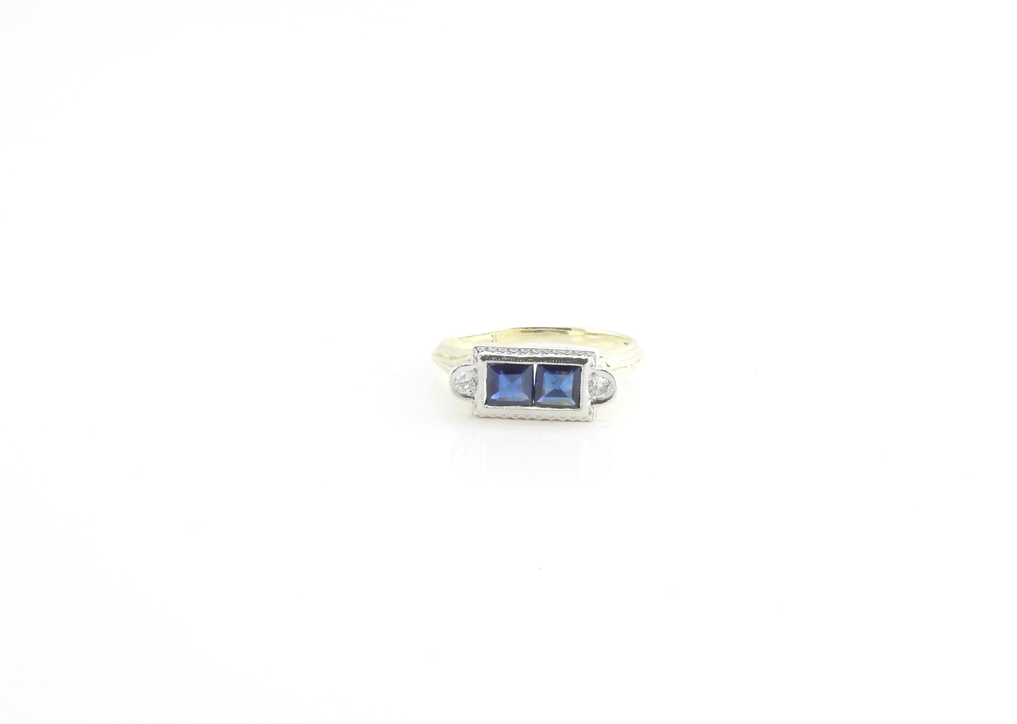 Vintage 14 Karat Yellow and White Gold Sapphire and Diamond Ring Size 6.5-

This lovely ring features two square sapphires and two round brilliant cut diamonds set in beautifully detailed 14K yellow and white gold filigree.  

Two princess sapphires