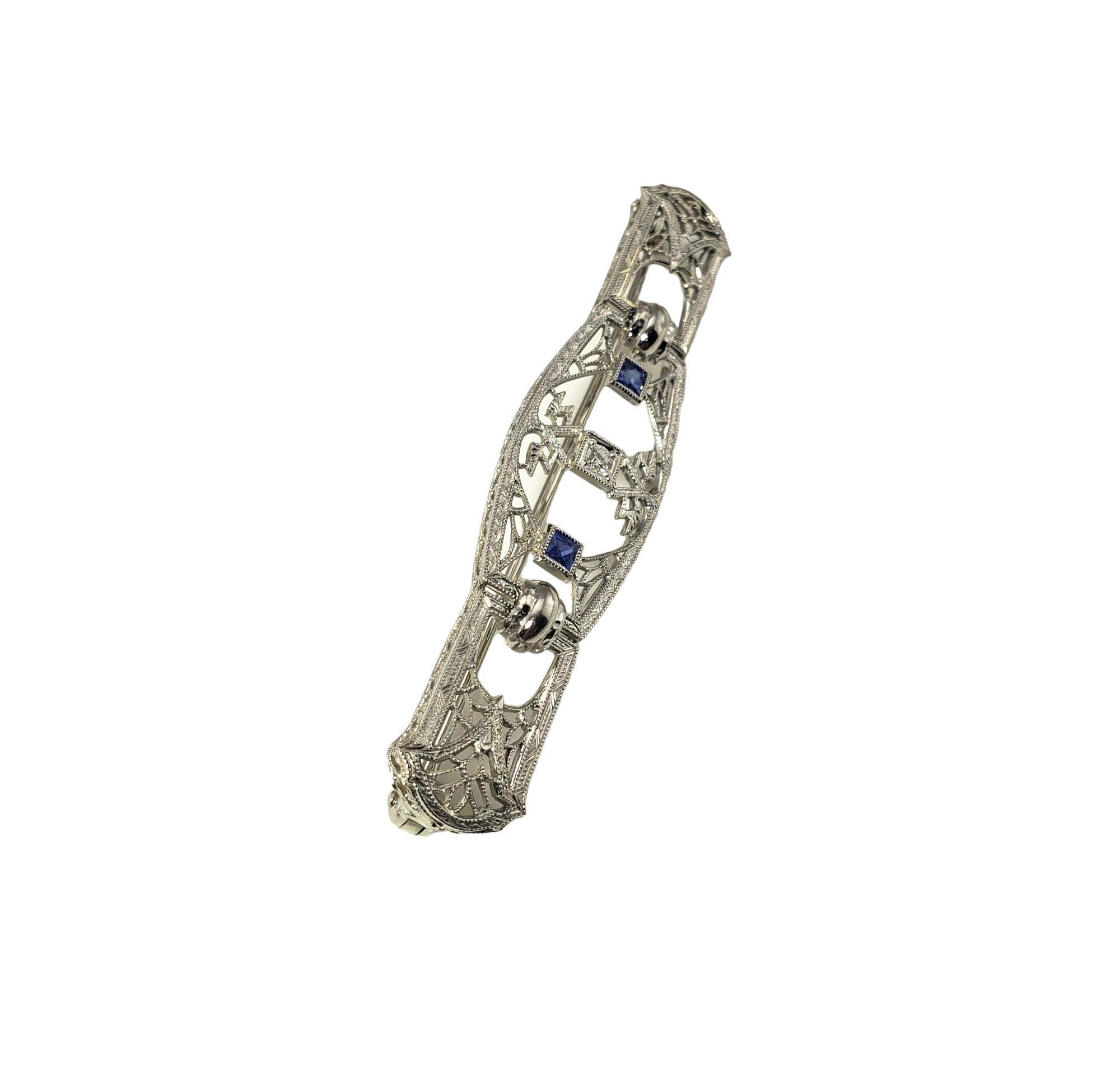 Vintage 14 Karat White Gold Filigree Diamond and Synthetic Sapphire Brooch/Pin-

This stunning brooch features two synthetic sapphires and one round brilliant cut diamonds set in beautifully detailed 14K white gold filigree.

Approximate total