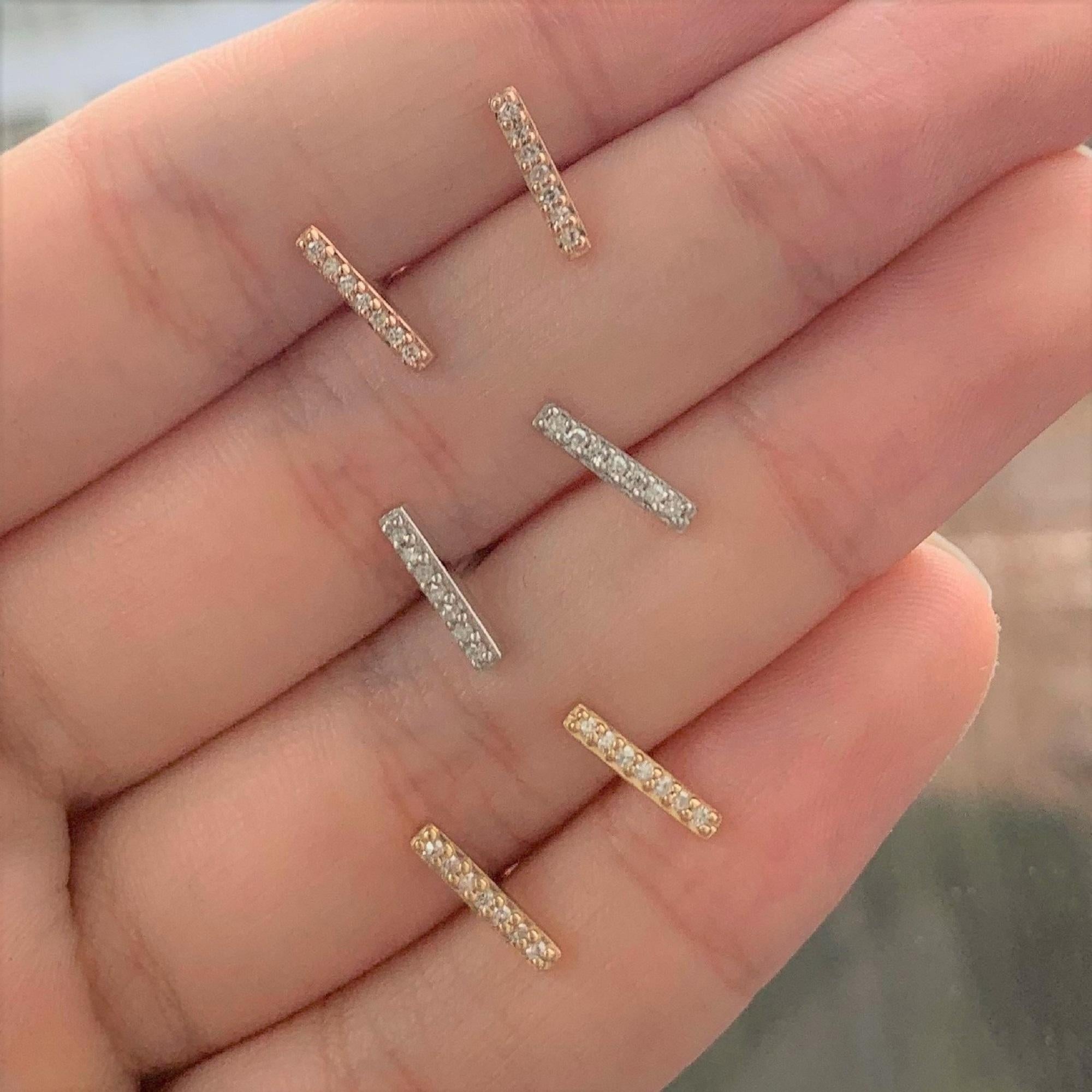 Classic, Gorgeous and Comfortable every day wear Diamond Bar Studs Earrings! Makes the perfect addition to your jewelry collection or a gift to someone dear for the holidays! Crafted of 14k gold featuring 14 round sparkling natural diamonds