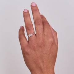 14 Karat White Gold 0.107 Carat Knot Round Diamond Ring