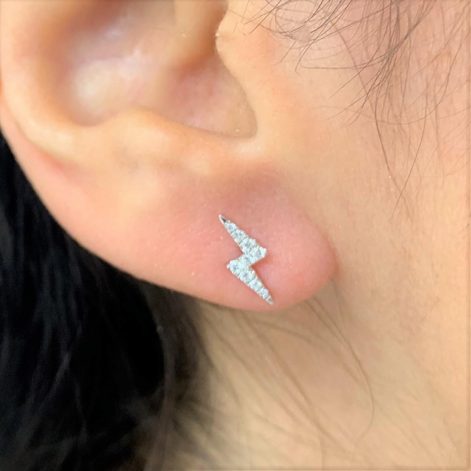 Show off your unique style with these striking lightning bolt earrings. The earrings are crafted in 14k gold and feature approximately 0.12 ct of natural white diamonds. The earrings are secured with butterfly backs. -Diamond color and Clarity GH