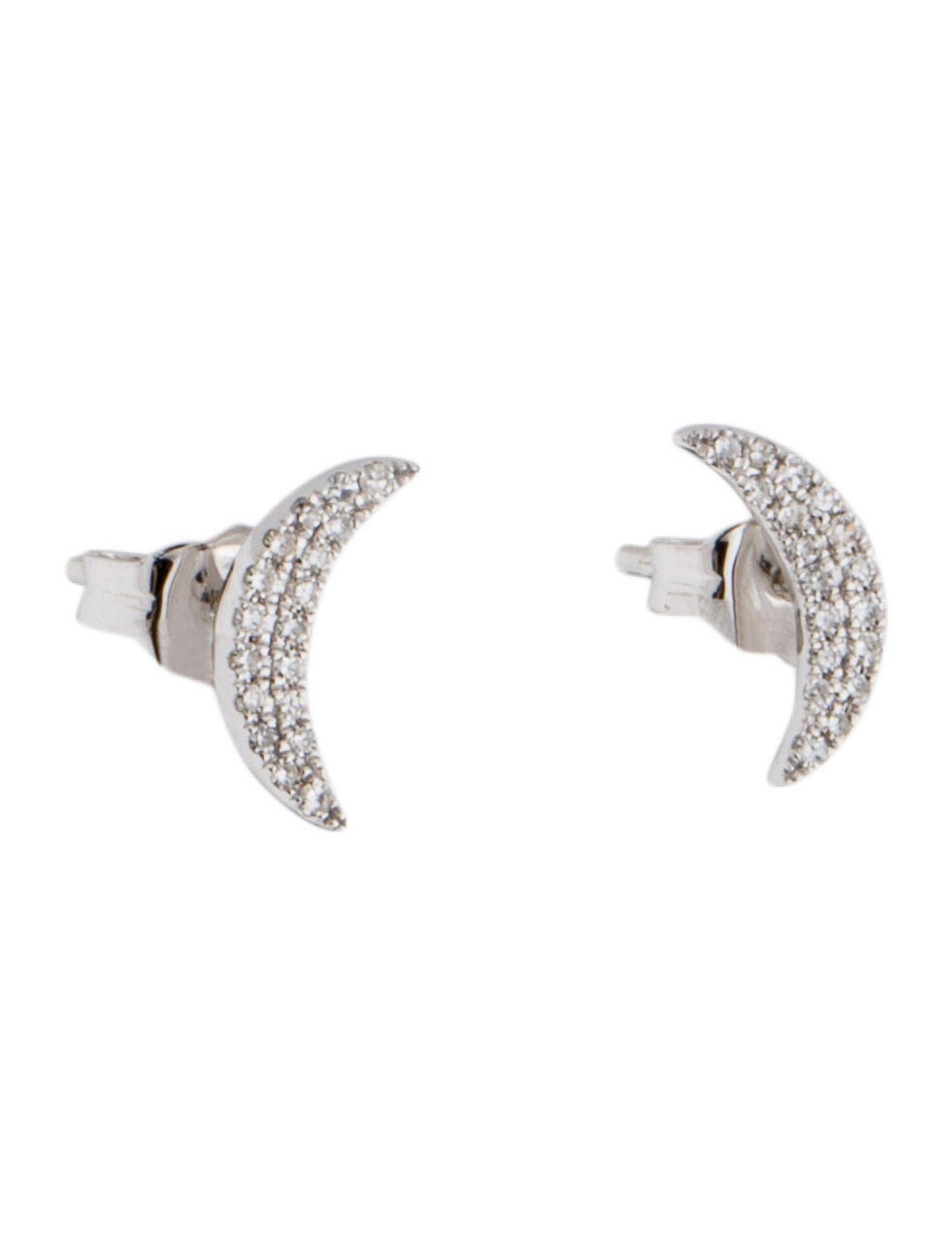 Pretty and classic diamond moon Studs earrings featuring approximately 0.12ct of genuine white diamonds crafted of 14k gold. These are available in white and yellow gold. Secured with butterfly backs.  Diamond color and Clarity GH SI1-SI2 
-14K