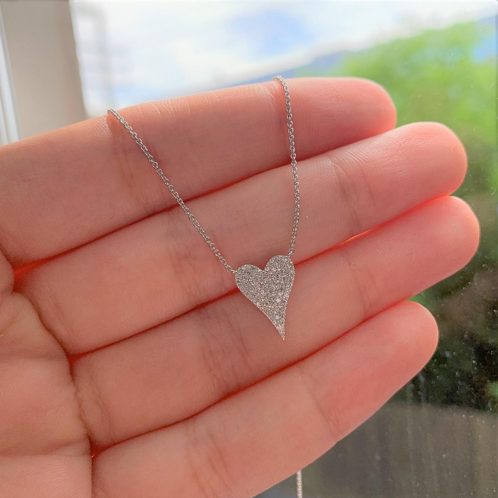This Stunning & Cute Pave Diamond Heart Pendant crafted of 14K White Gold features approximately 0.17 ct of Round Natural Diamonds, on an adjustable 16,17 & 18