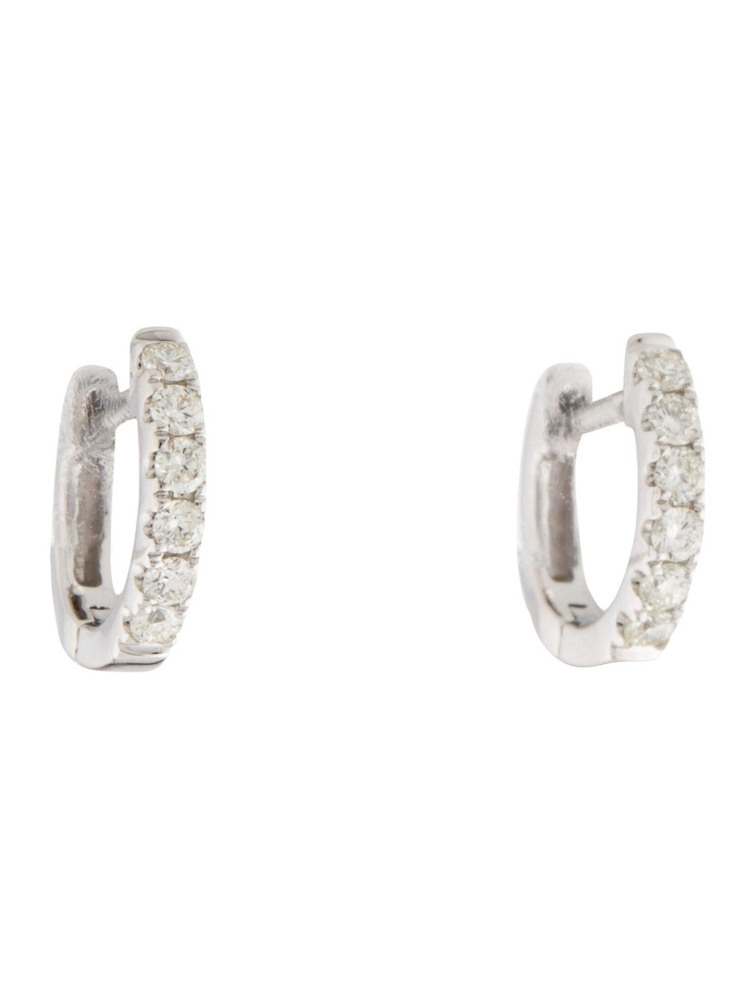 Simple yet stunning, these Diamond huggie hoops are crafted from 14k gold with 13 glittering white 0.18 ct. of diamonds. Each delicate U-shaped hoop features a single line of white diamonds, pave-set across the face in a gorgeous display.
-14K