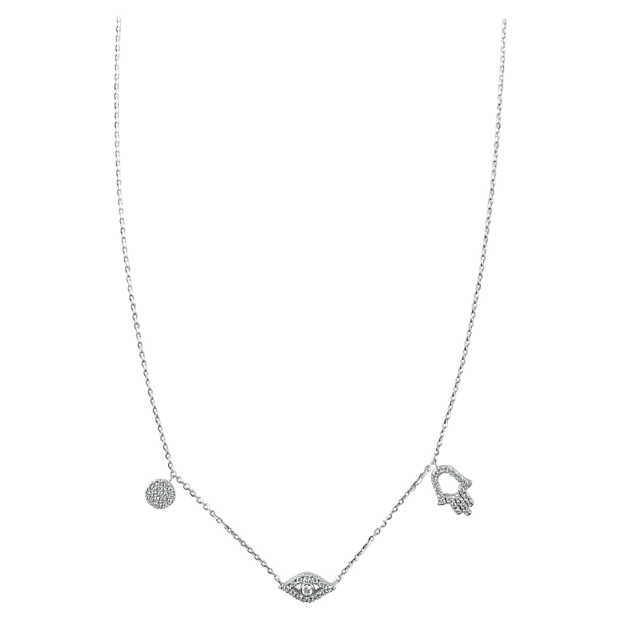 Collier en or blanc 14 carats avec œil maléfique et Hamsa en diamants 0,23 carat en vente
