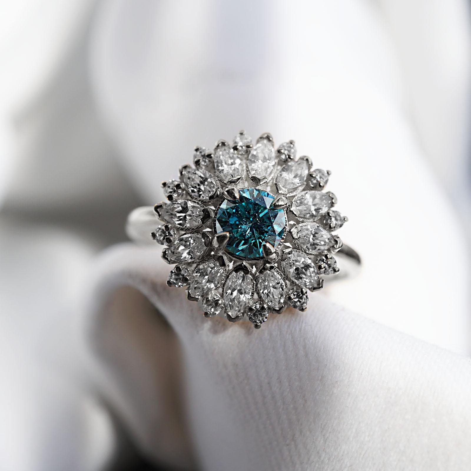 ** Tippy Taste Heirloom Collection is made to order. Please allow 3-4 week turnaround time. Make a note of your ring size and metal color during checkout.

This blue diamond ring features a rare teal blue diamond. Its vibrant color makes for a