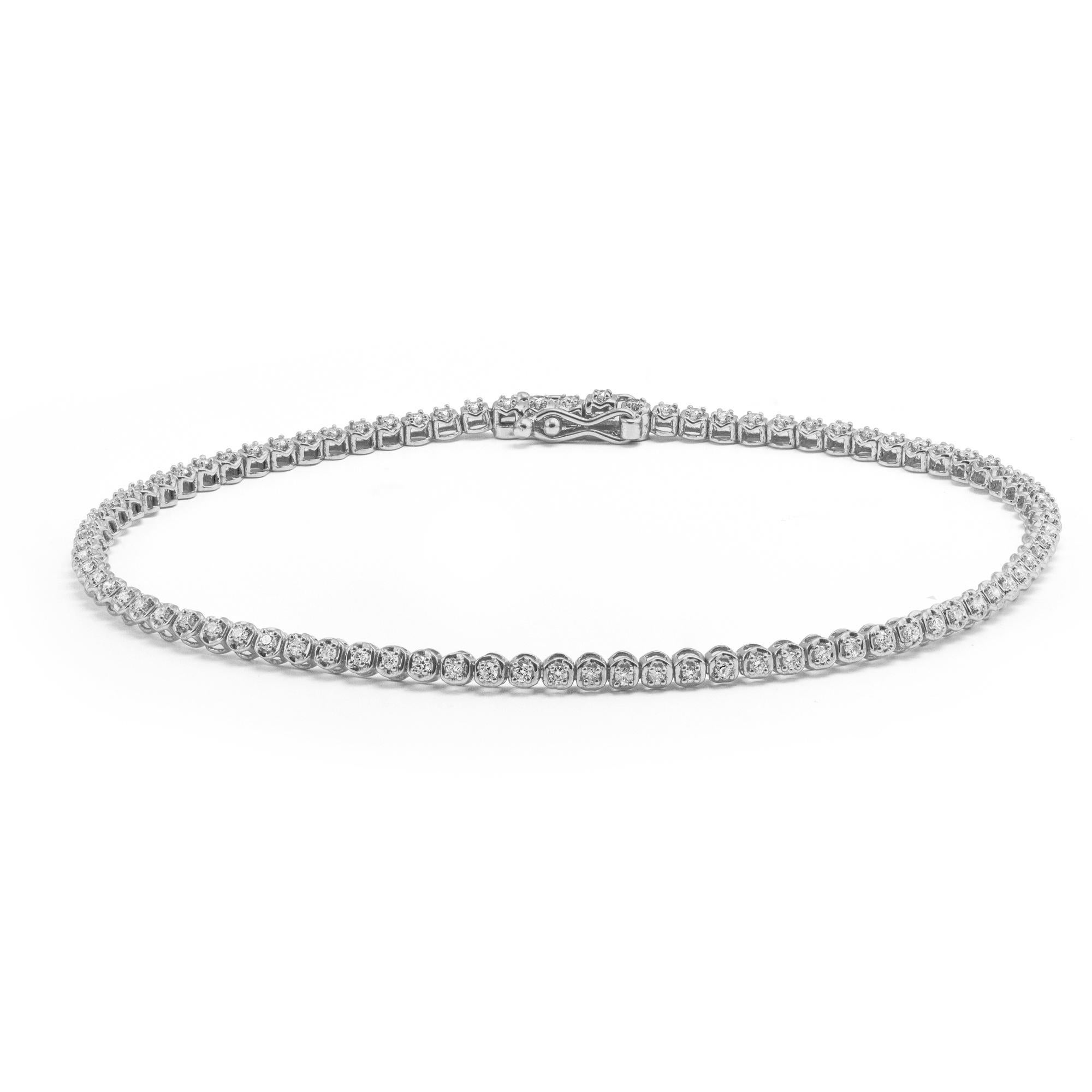 This Round Brilliant Diamond Tennis Bracelet is made in 14 karat White Gold, set with natural, colourless diamonds. With a total diamond carat weight (approximate) of 0.50 carat, The Diamonds are G-H colour, VS-Si clarity. Also comes in 14 karat