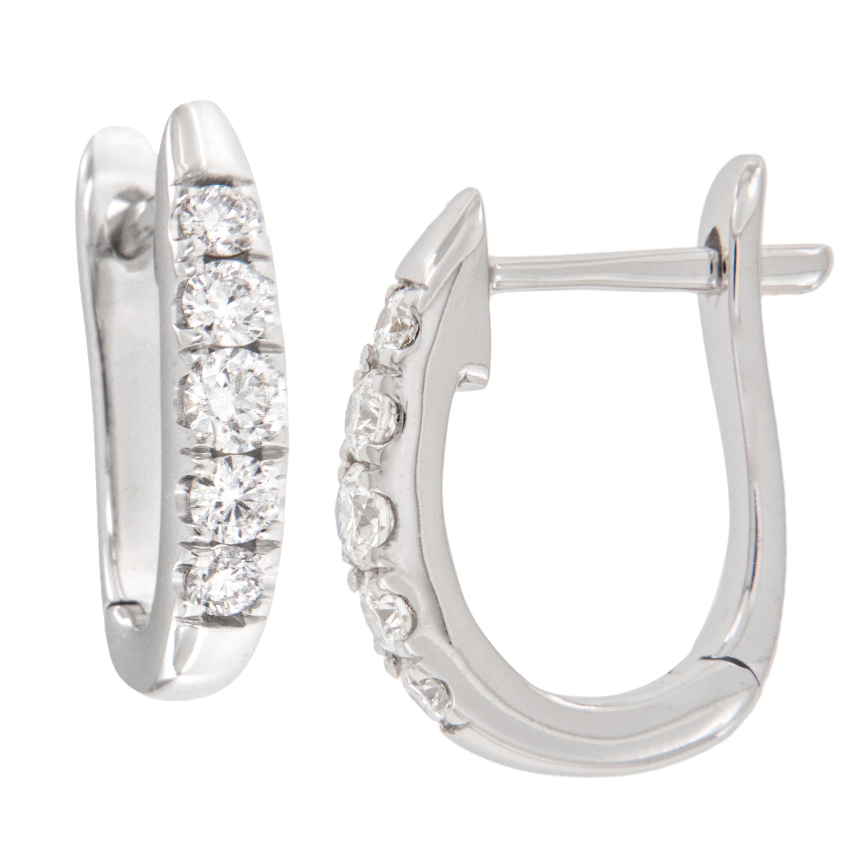 Everyone needs a diamond hoop as a staple in their jewelrybox, why not set yourself apart while still being timeless?! These 14 karat white gold diamond hoop earrings are accented with 10 round brilliant cut diamonds = 0.54 Cttw (VS, G-H) in a
