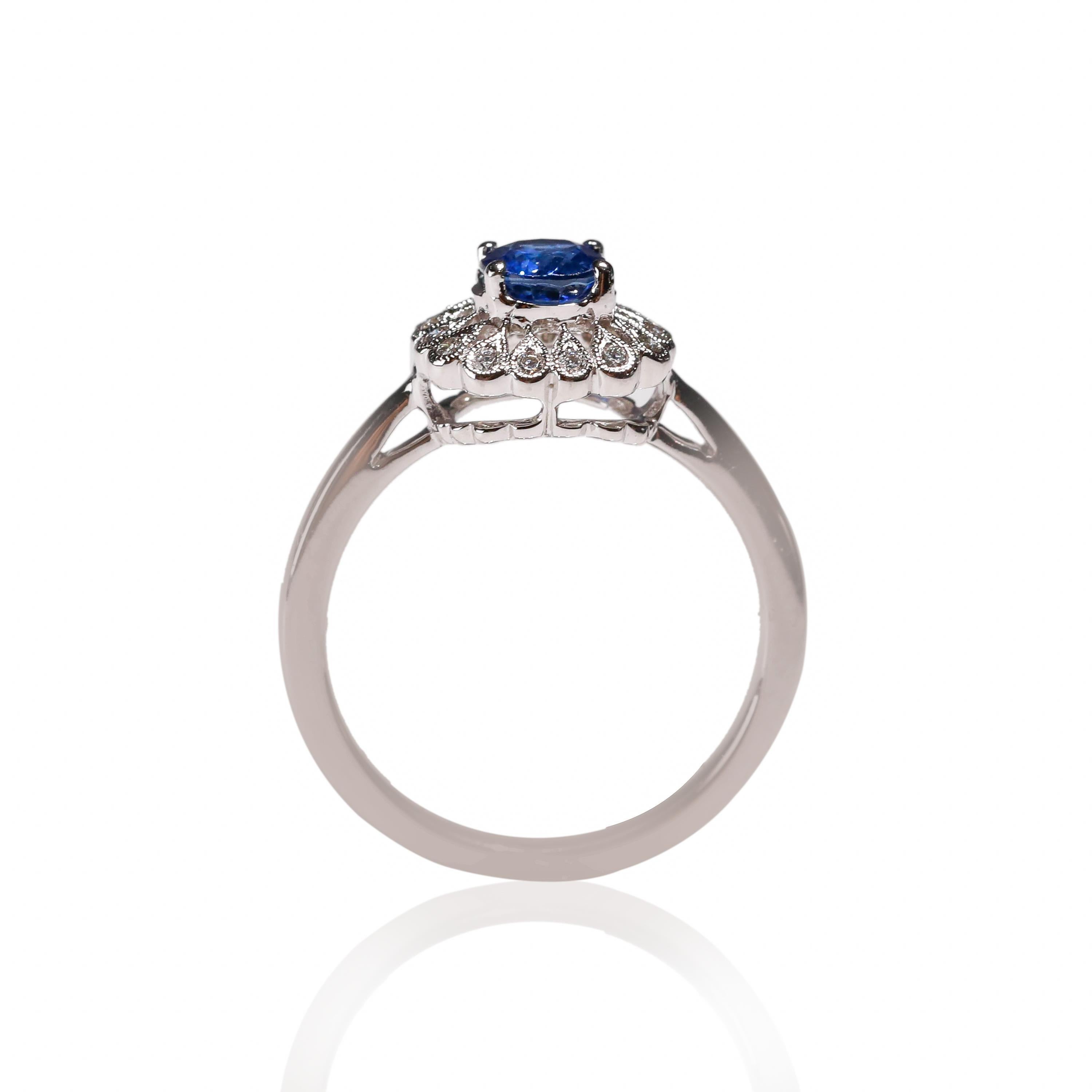 14 Karat White Gold 0.87 Carat Oval Blue Sapphire Diamond Floral Halo Ring

Crafted in 14 kt White Gold, this Unique design showcases a Blue Sapphire 0.87 TCW Oval shaped Sapphire, set in a halo of round-cut mesmerizing diamonds, Polished to a