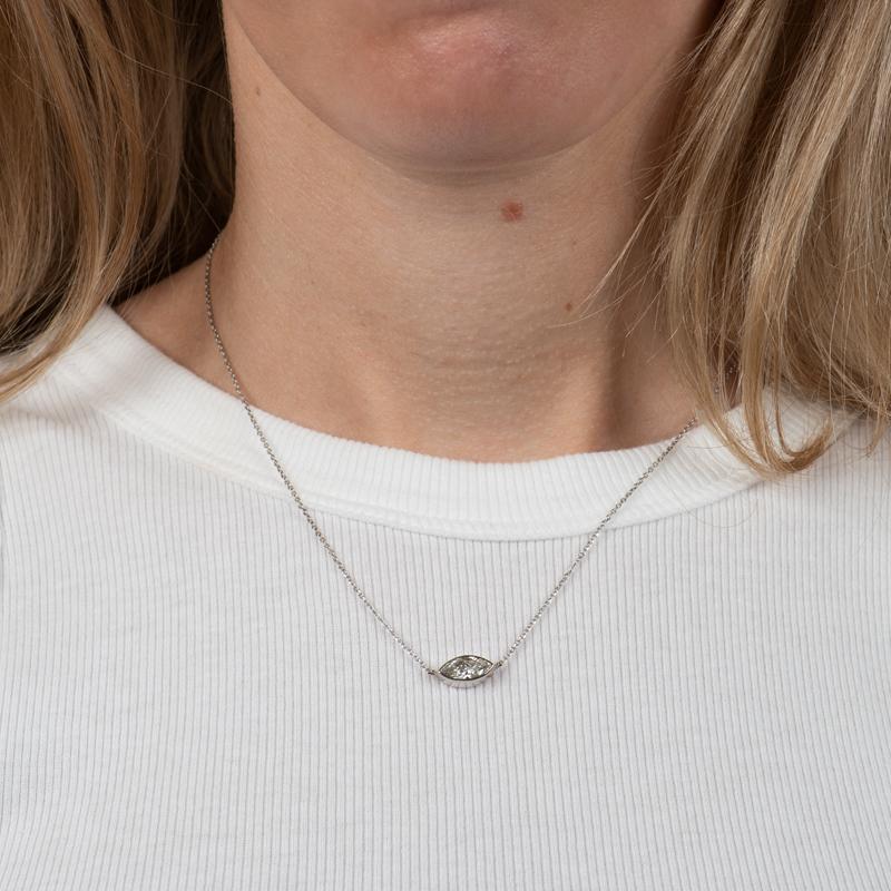 This necklace features a bezel-set 0.92 marquise diamond, H SI2, set east-west in 14 karat white gold. The 14 karat white gold chain is adjustable from 16-18