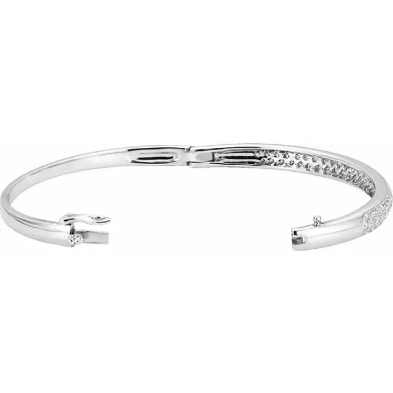 14K White Gold 1 1/2 Carats Diamond Bangle 7.0 inches Bracelet

With Round Diamonds, 1.50 Carat Total Weight

Diamonds are F/G in Color and VS/SI in Clarity 

Each stone measures 1.50mm.

Set in 14 Karat White Gold

Shipped in a gift box.

ITEM