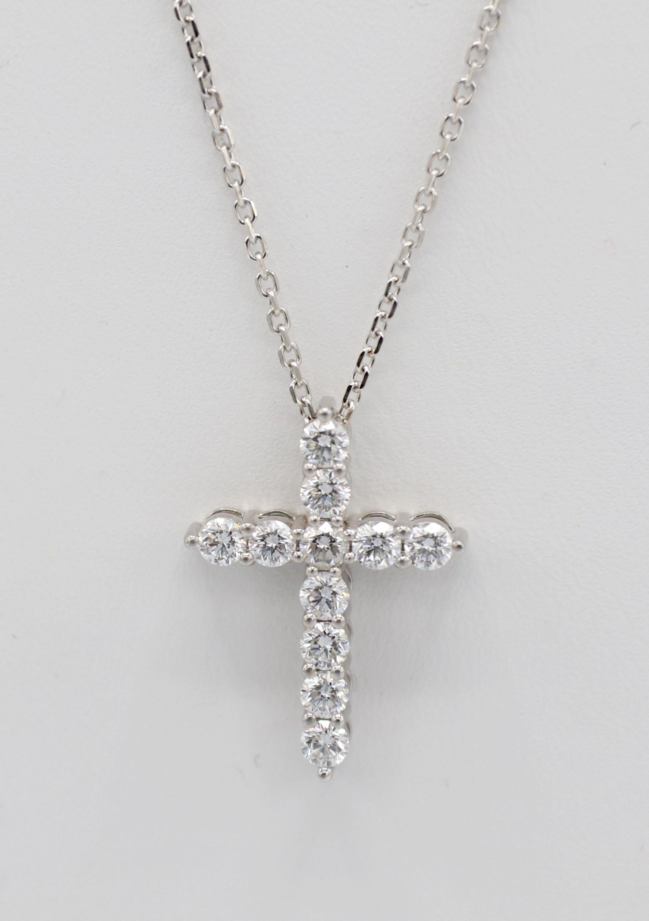 14 Karat White Gold 1.00 Carat Natural Diamond Cross Pendant Drop Necklace 
Metal: 14k white gold
Weight: 4.65 grams
Diamonds: Approx. 1.00 CTW F-G VS round natural diamonds
Cross: 22.5 x 16.5mm
Chain length: 18 inches, adjustable to 17 & 16 inches
