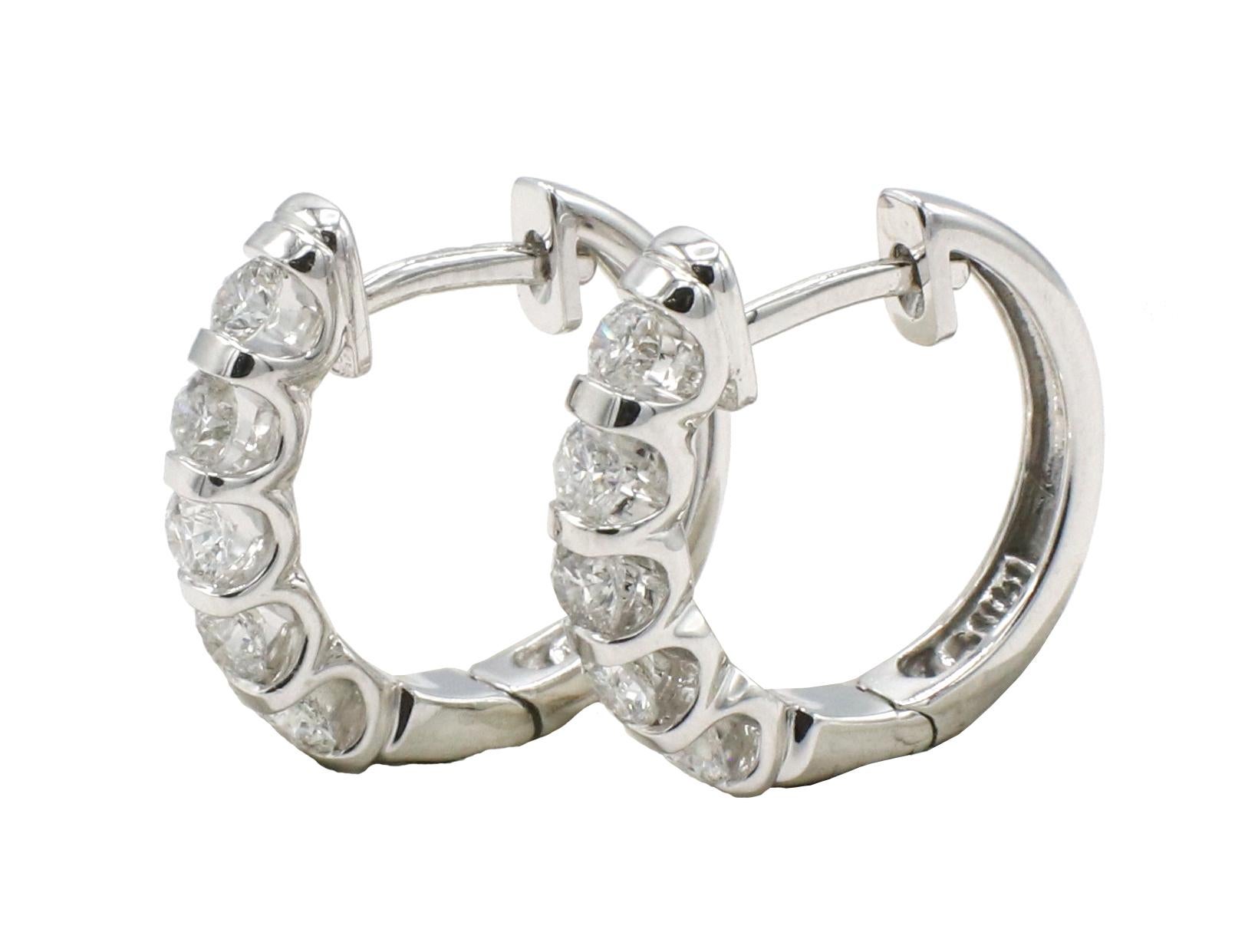 14 Karat White Gold 1.00 Carat Diamond Huggie Hoop Earrings 
Metal: 14k white gold
Weight: 5.5 grams
Diamonds: Approx. 1.00 CTW G-H VS round diamonds
Diameter: 18mm
Width: 3mm
Length: 17mm
