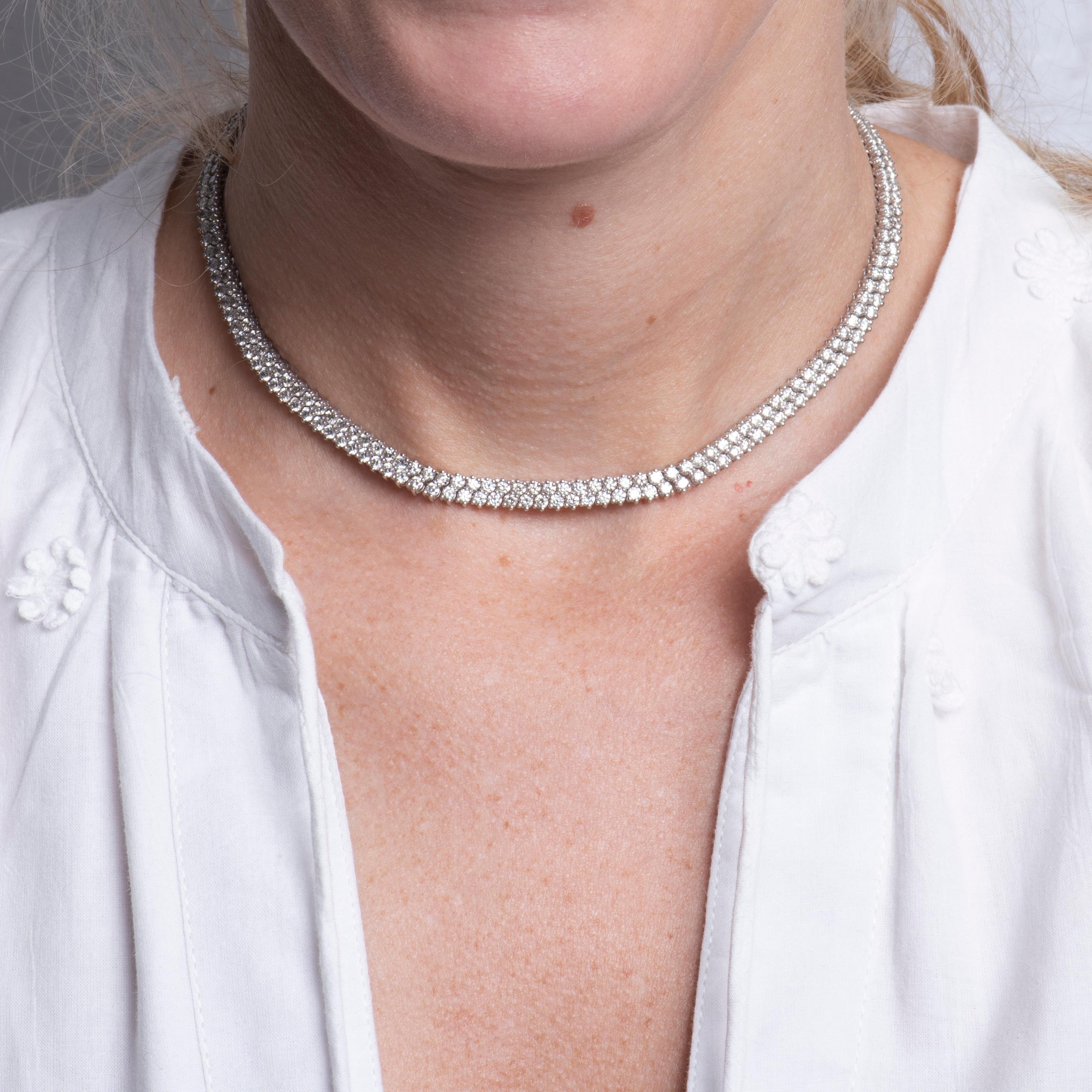 This adjustable choker necklace features 10.13 carat total weight in round brilliant cut natural diamonds set in two rows in 14 karat white gold. Wear alone or layer with your other favorite necklaces and wear at whichever length you desire. This