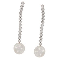 Pendientes de oro blanco de 14 quilates con perla blanca de 10,55 mm y diamantes de 0,50 qt