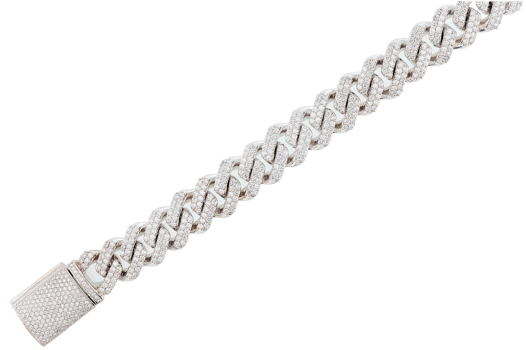 This bracelet is made in 14K white gold. The bracelet features 651 round cut, prong set diamonds weighing 10.71 carats with a color grade (G) and a clarity grade (VS2) and contains  107 grams of gold. 
