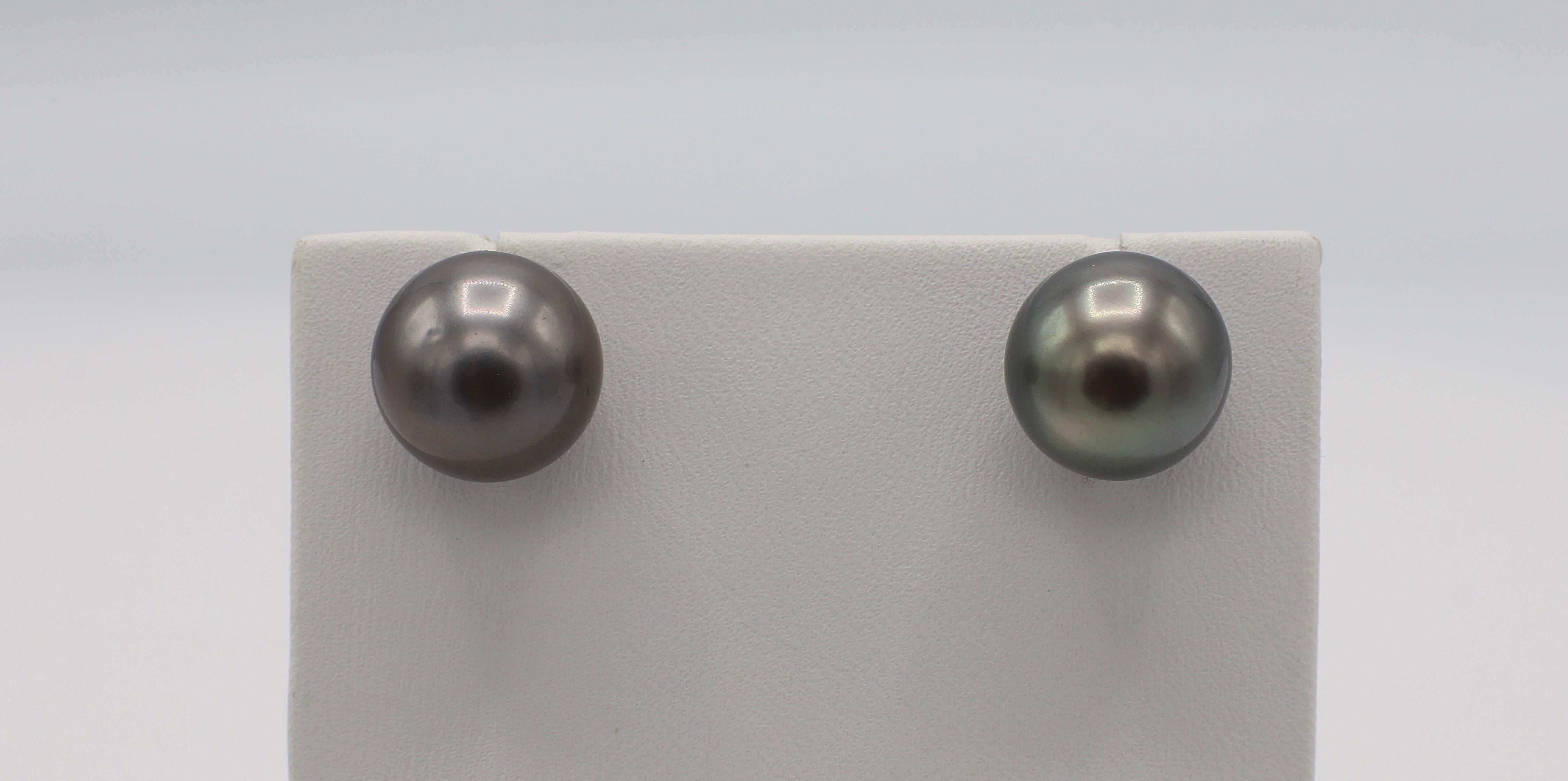 14 Karat White Gold 13MM Tahitian Pearl Stud Earrings 
Metal: 14K white gold
Weight: 7.59 grams
Pearls: 2 gray Tahitian 13mm pearls with high luster and beautiful color
